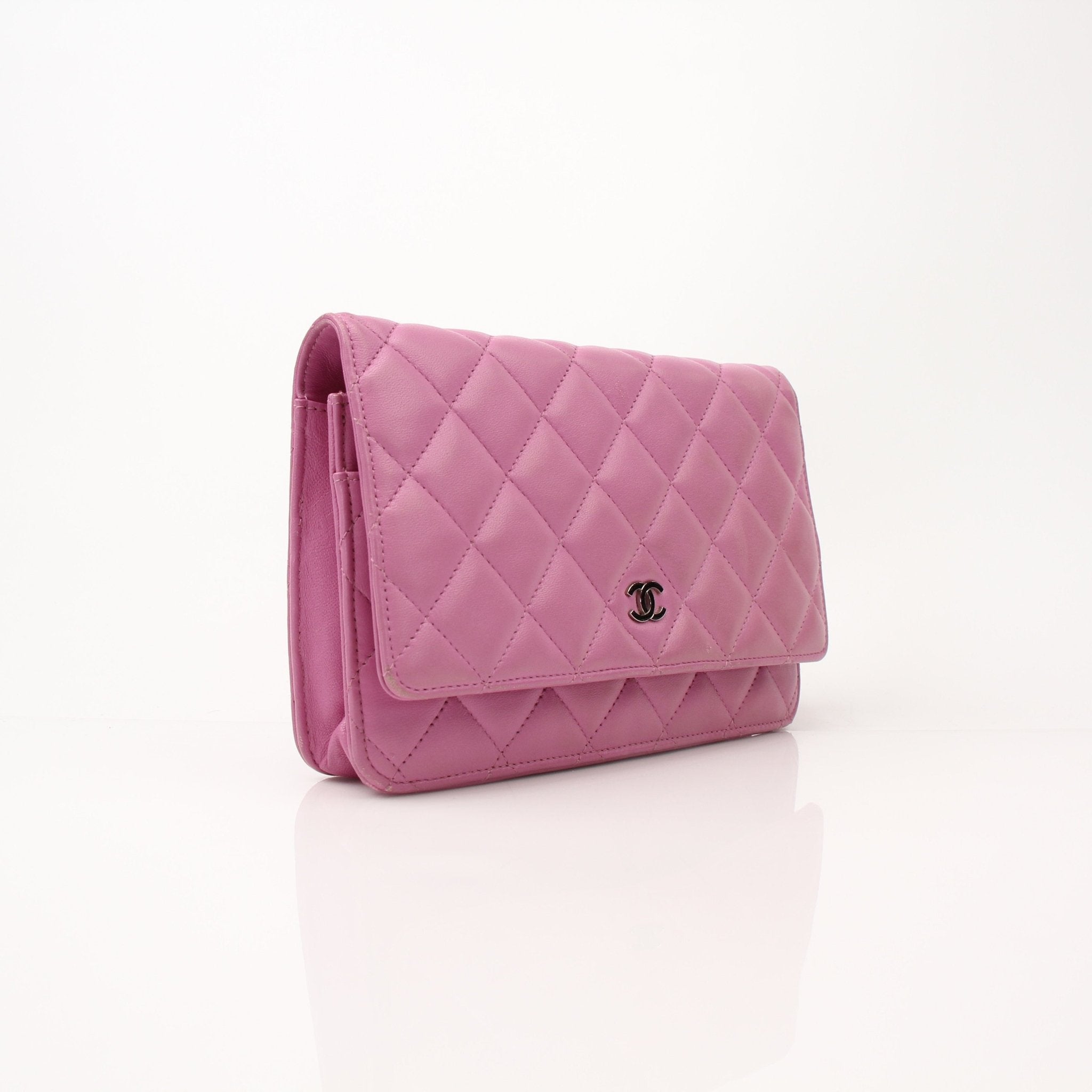 Gold & Beyond light purple Chanel wallet on chain, showing the stylish wallet with chain strap and elegant design.