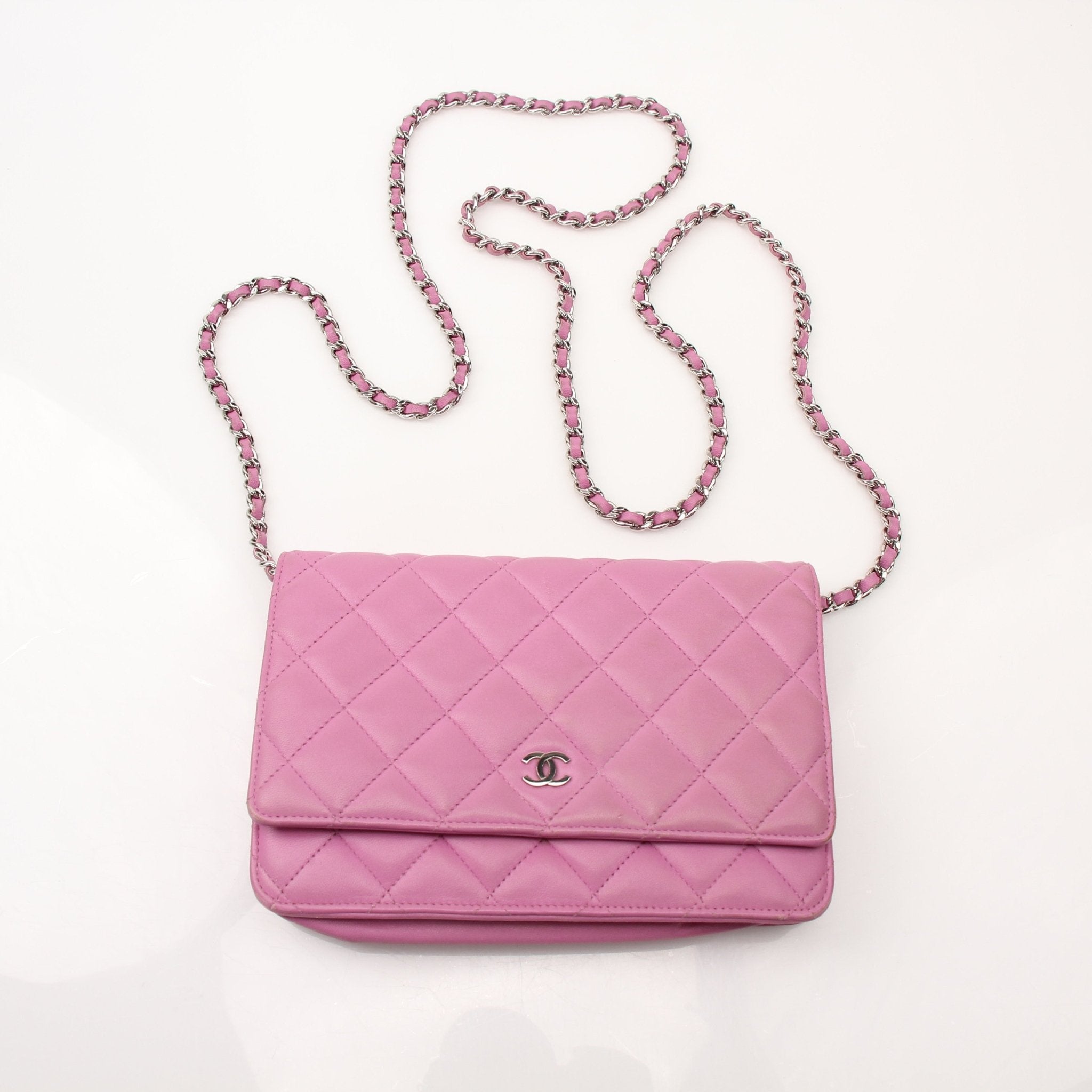 Gold & Beyond light purple Chanel wallet on chain, compact leather wallet with chain strap and gold accents, stylish and functional.