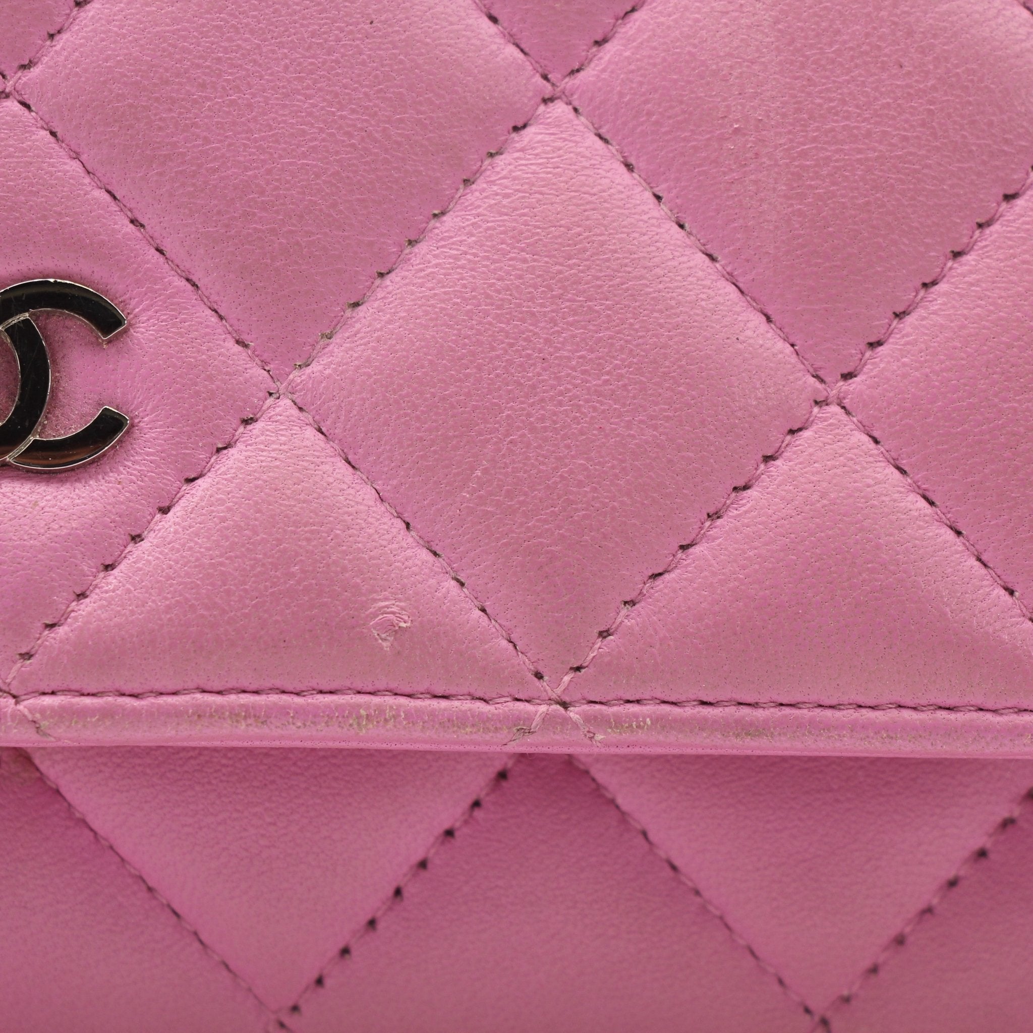 Gold & Beyond light purple Chanel wallet on chain with compact design, gold hardware, and textured leather exterior.