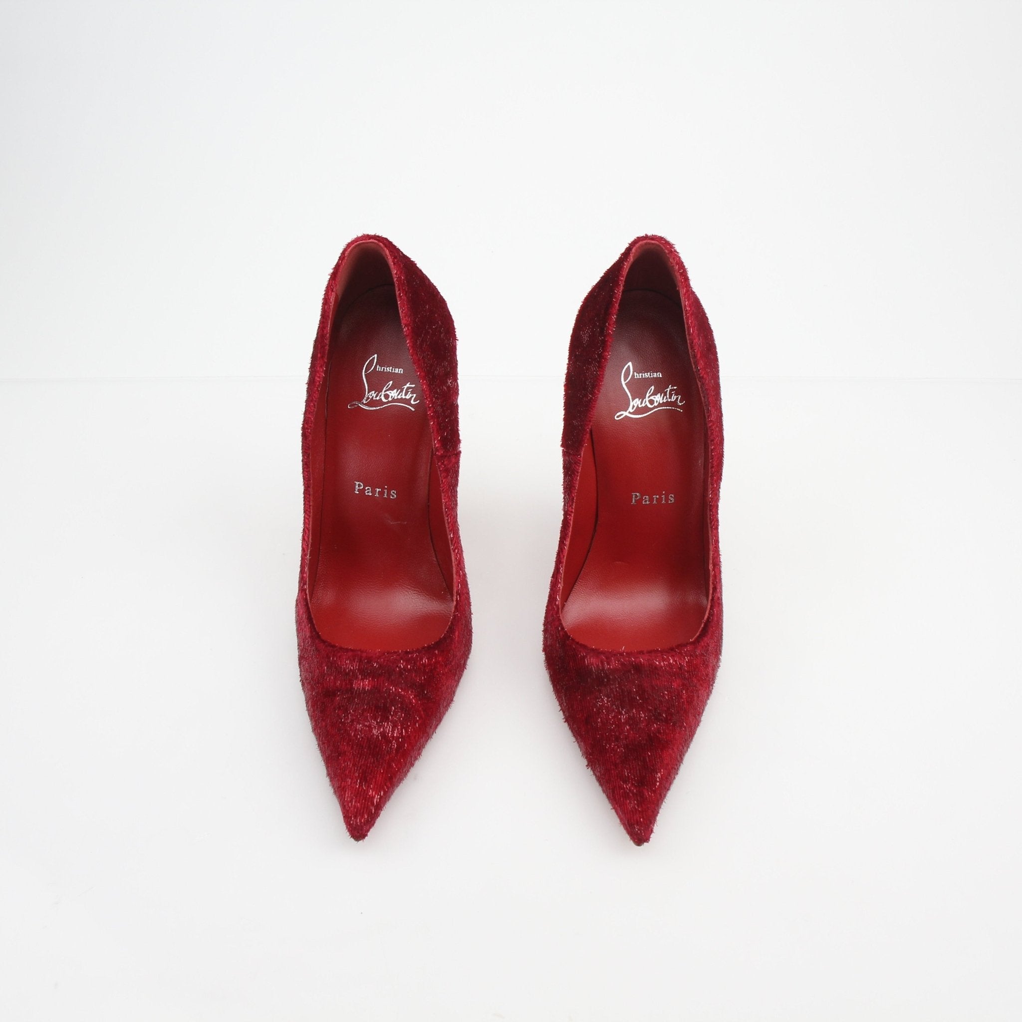 Christian Louboutin Miss Z velvet glitter pumps with pointed heels and signature red soles, showcased on a white background.