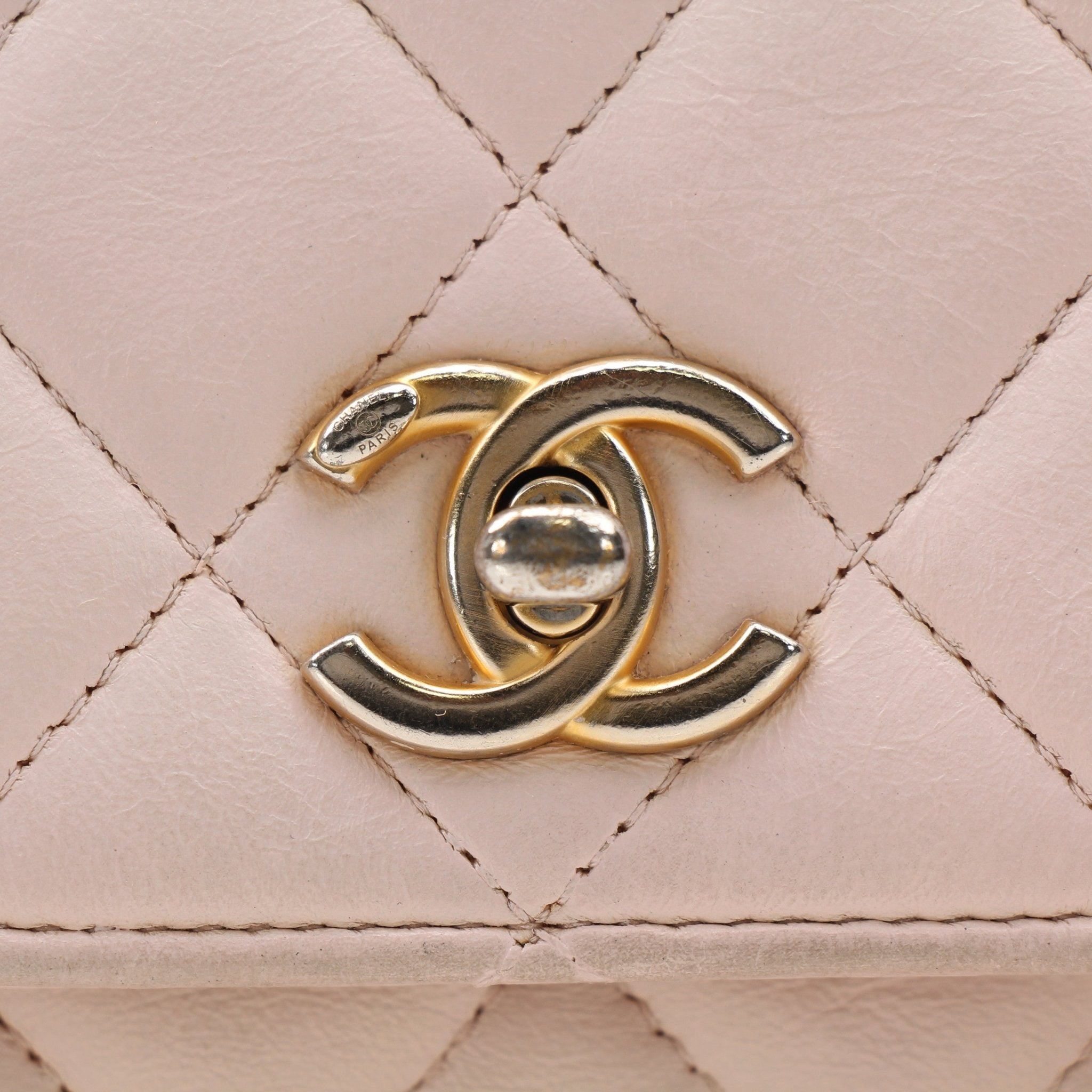 Gold & Beyond pink Chanel wallet on chain with gold hardware, featuring a blush pink leather wallet and chain strap.