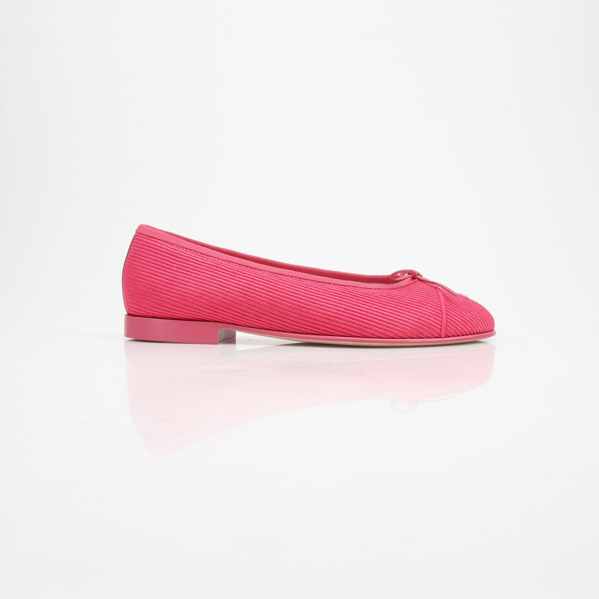 Gold & Beyond pink corduroy Chanel CC bow ballerina flats shoes with a sleek design and comfortable fit.