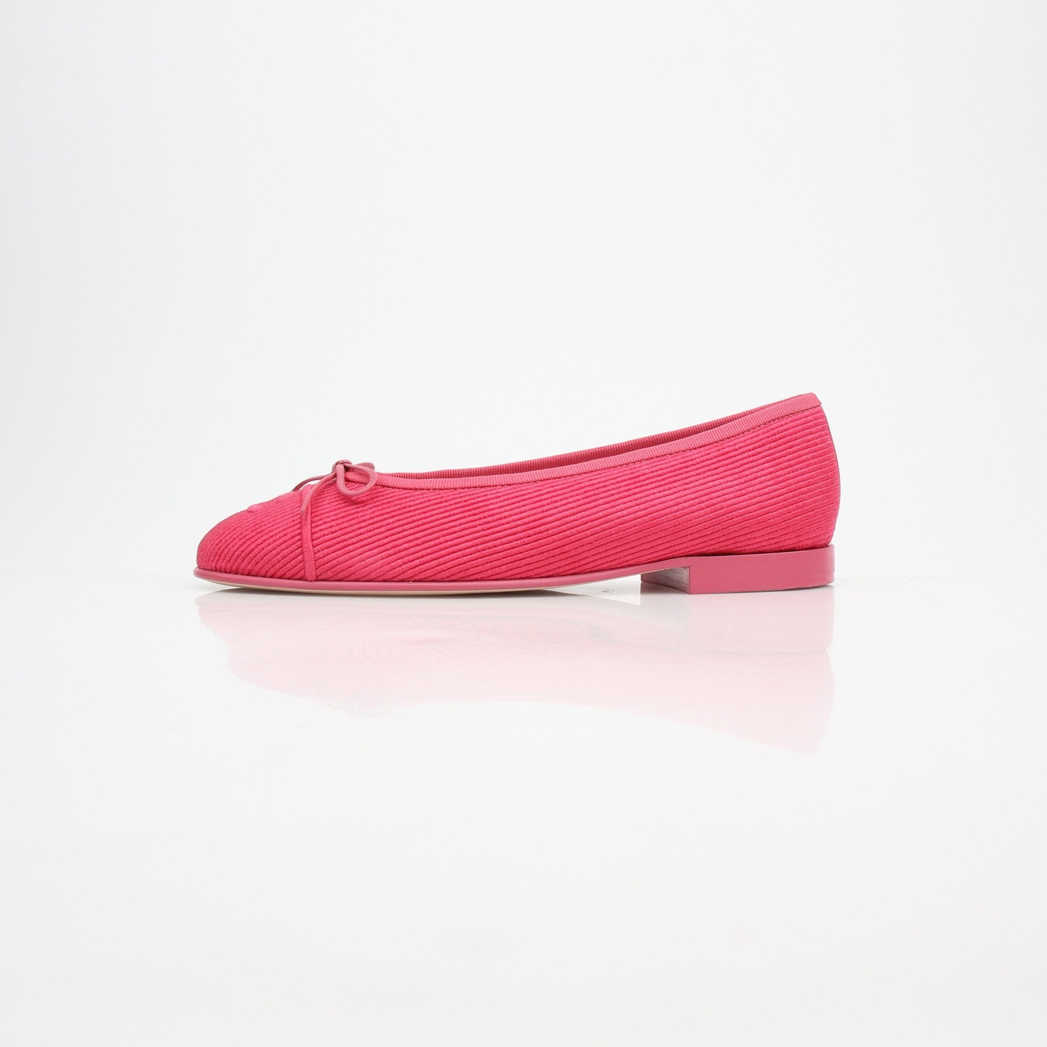 Gold & Beyond Chanel pink corduroy CC bow ballerina flats, showing the stylish shoes with bow detail and soft corduroy fabric.
