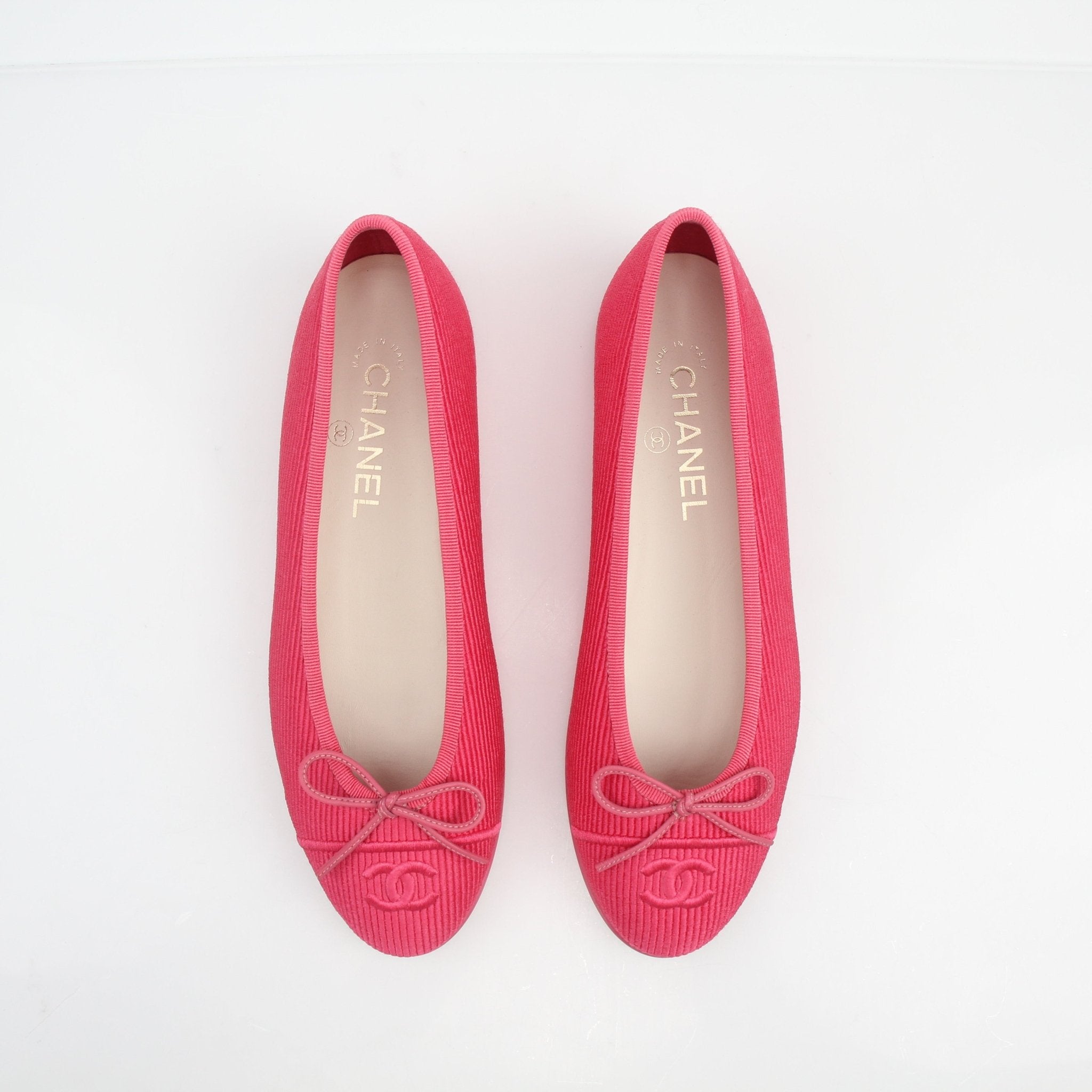 Gold & Beyond Chanel pink corduroy CC bow ballerina flats, stylish shoes with bow detail and comfortable slip-on design.