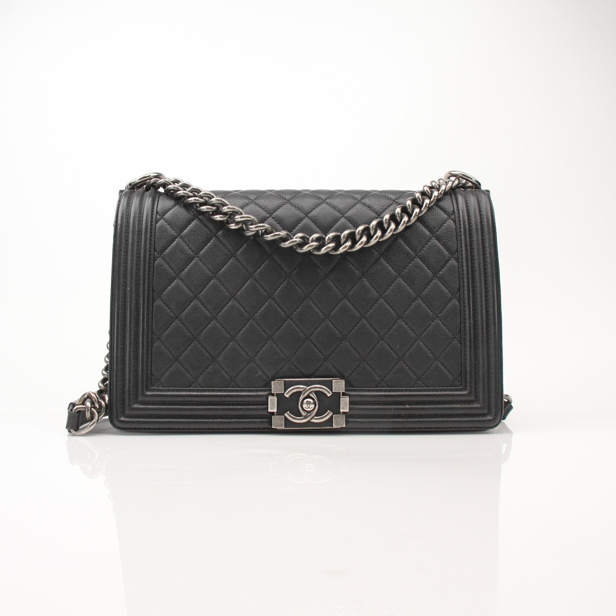 Gold & Beyond Chanel Boy Quilted Flap Bag handbag with gold hardware and signature quilted design, stylishly displayed.