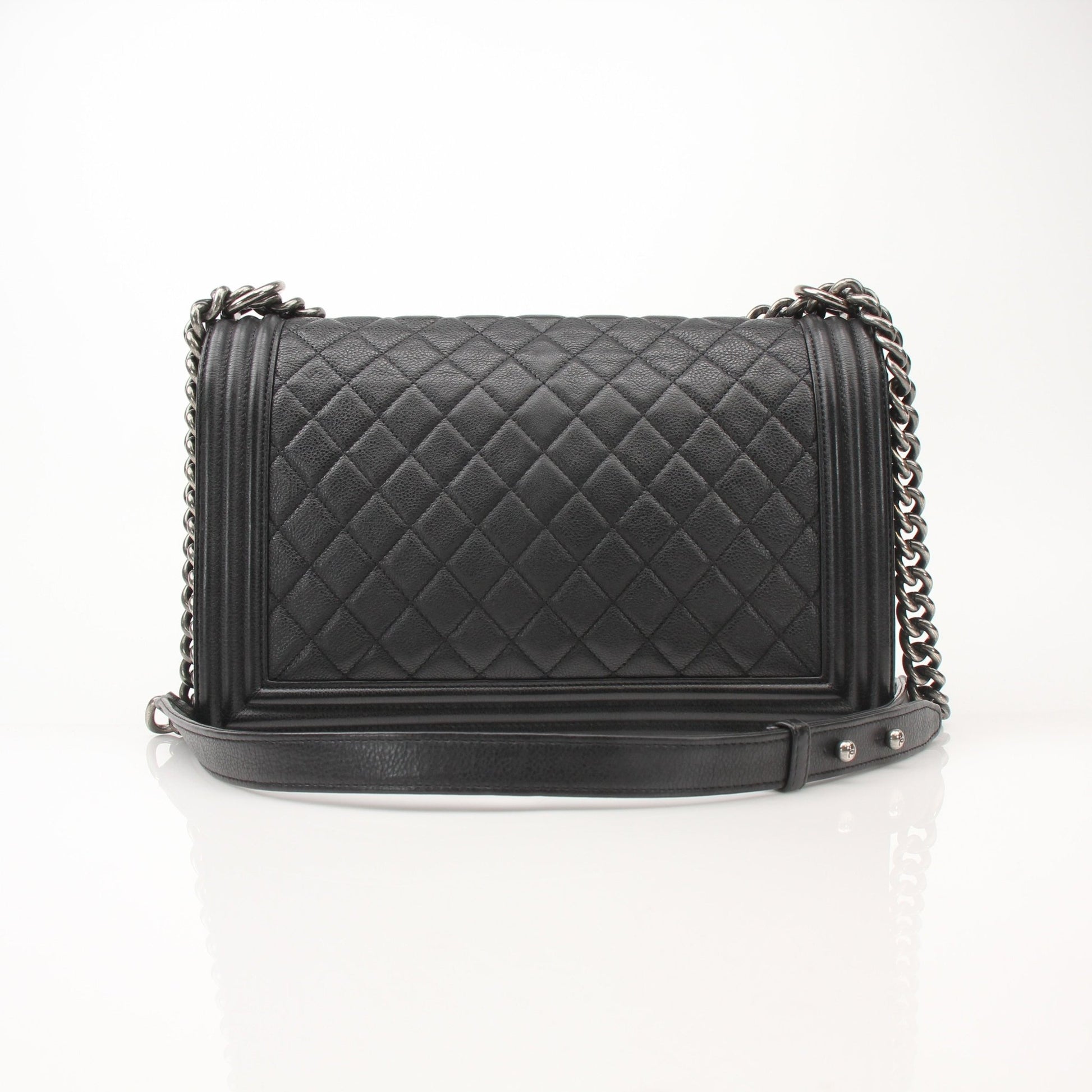 Gold & Beyond Chanel Boy Quilted Flap Bag handbag with gold chain strap and signature quilting design.