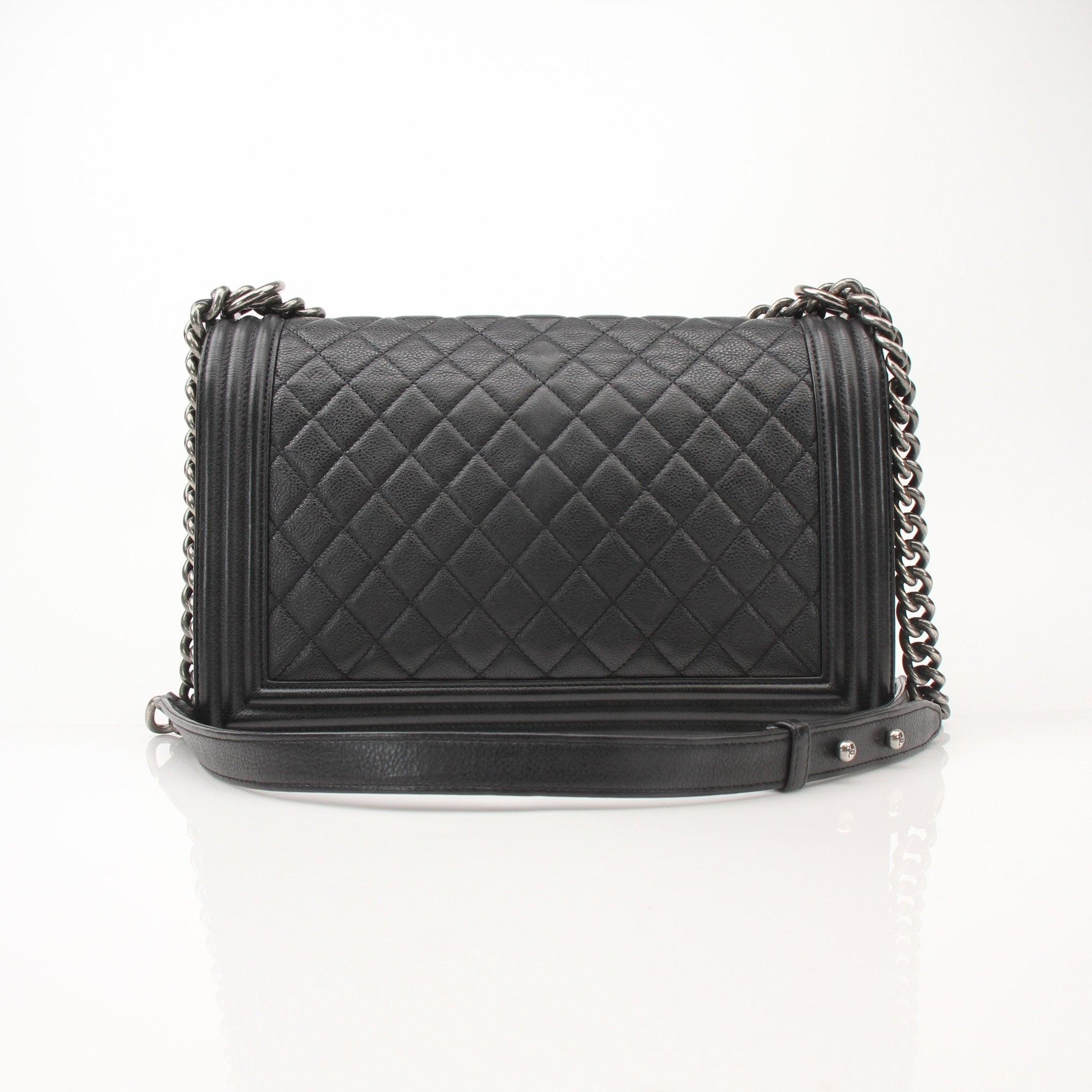 Gold & Beyond Chanel Boy Quilted Flap Bag handbag with gold chain strap and signature quilting design.