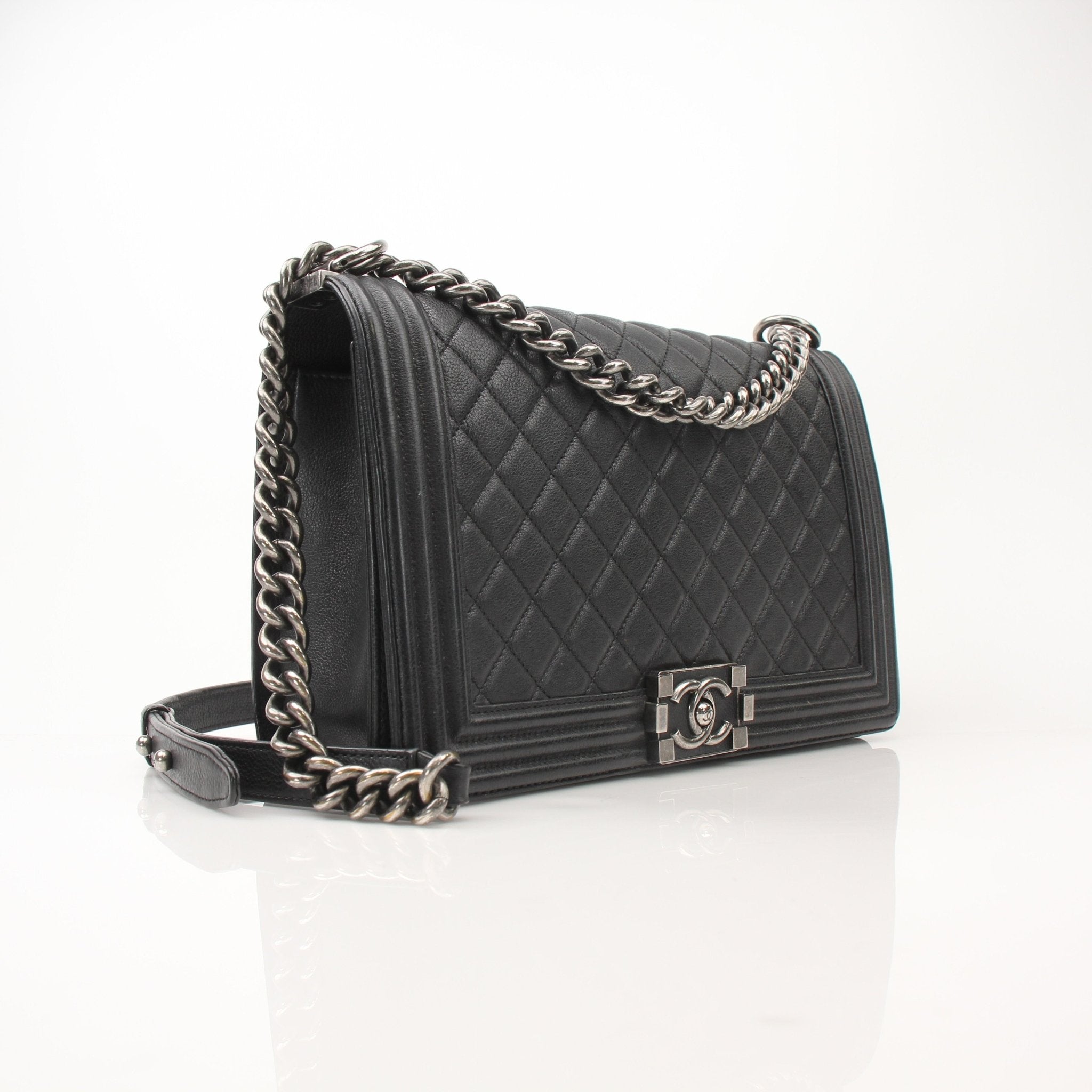 Gold & Beyond Chanel Boy Quilted Flap Bag handbag with gold chain strap and signature quilted leather design.