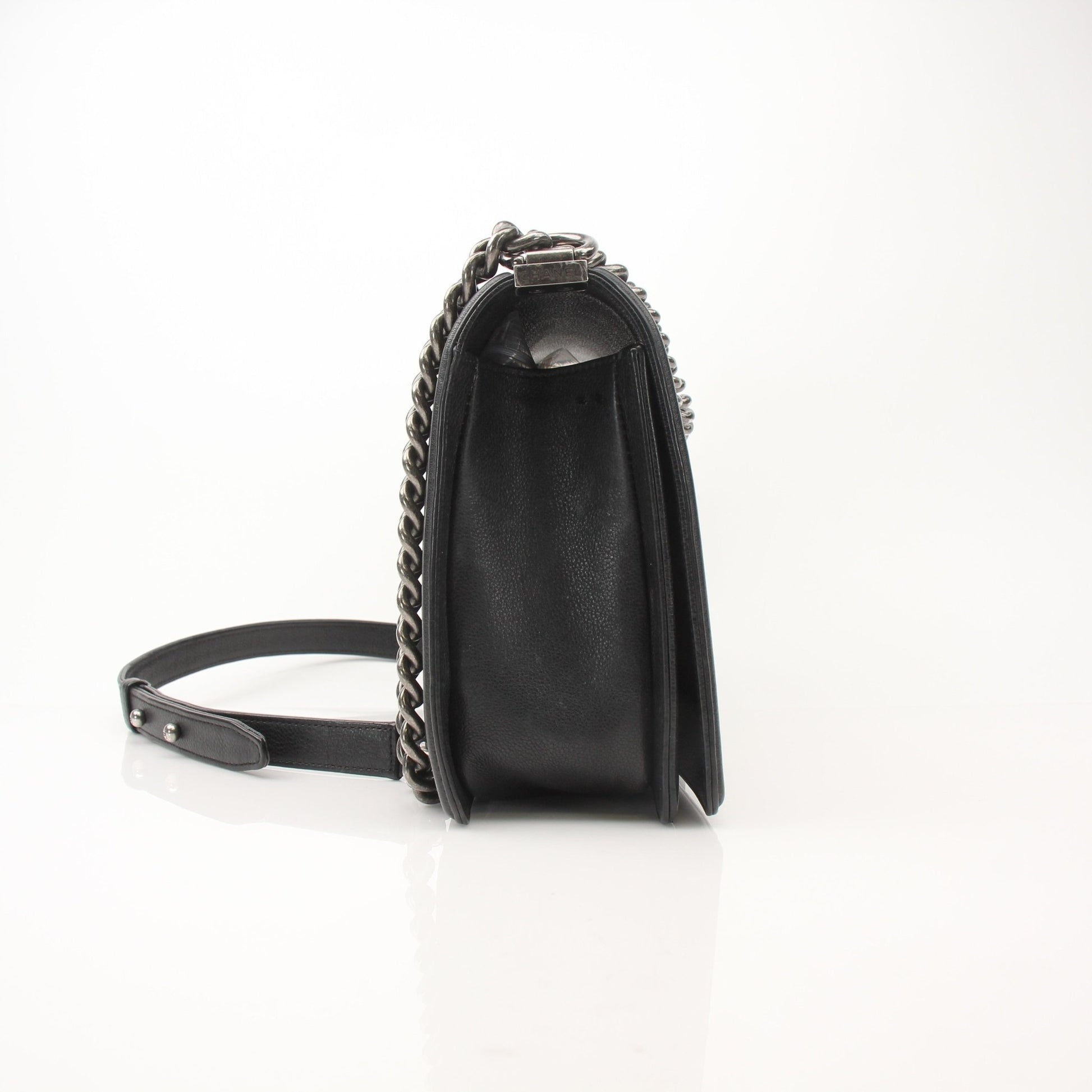 Gold & Beyond Chanel Boy Quilted Flap Bag handbag with gold chain strap and signature quilted leather design.