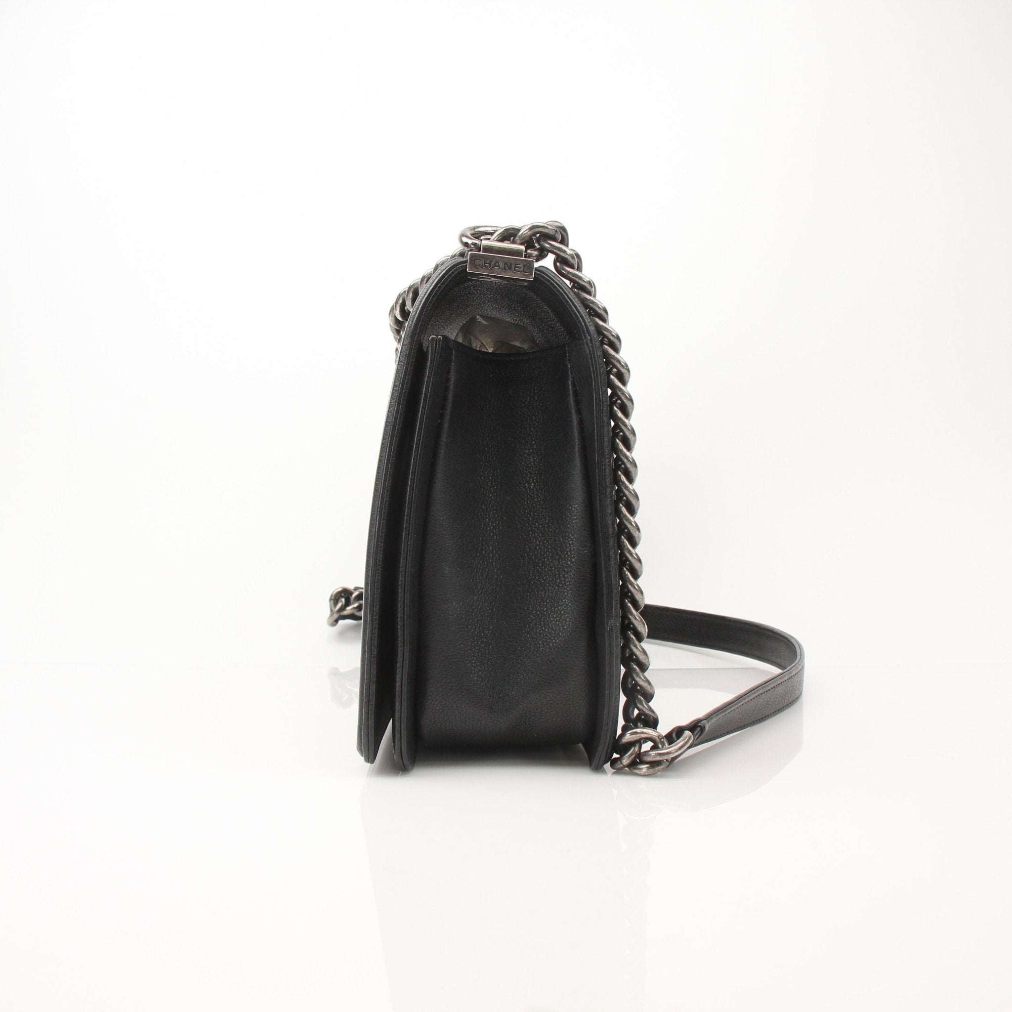 Gold & Beyond Chanel Boy Quilted Flap Bag handbag with gold chain strap and signature quilted design, front view.