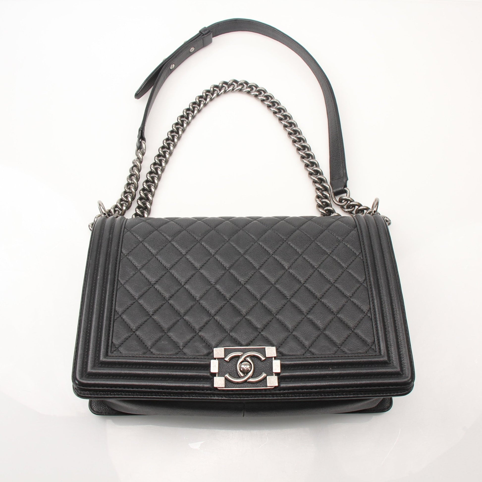 Gold & Beyond Chanel Boy Quilted Flap Bag handbag with gold hardware and quilted leather design.