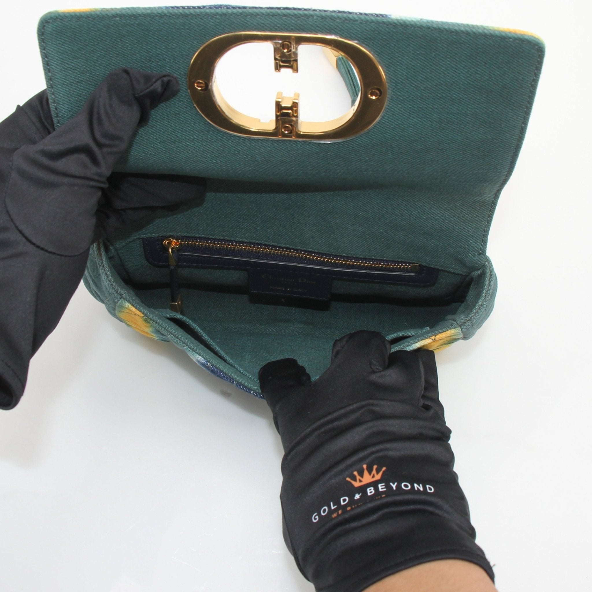 Christian Dior Caro small tie-dye denim handbag featuring shoulder strap and gold-tone hardware.