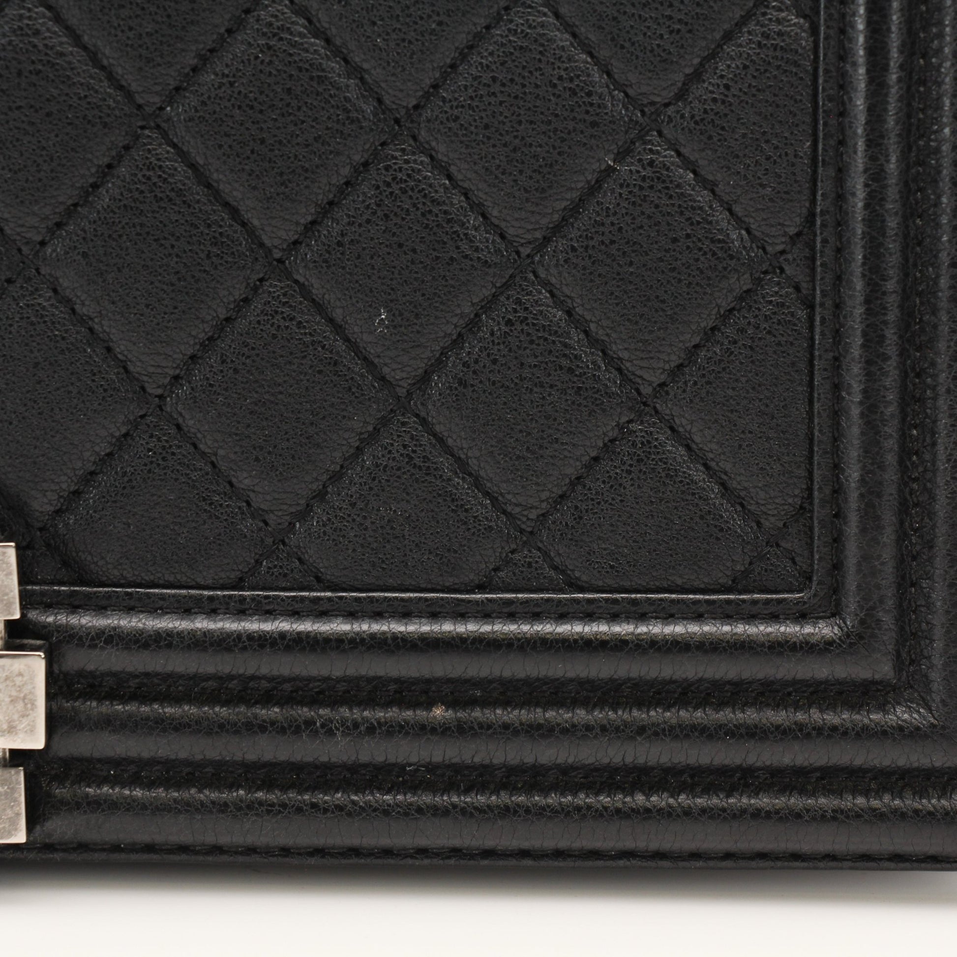 Gold & Beyond Chanel Boy Quilted Flap Bag handbag with gold hardware and quilted design, featuring a chain strap and signature logo.