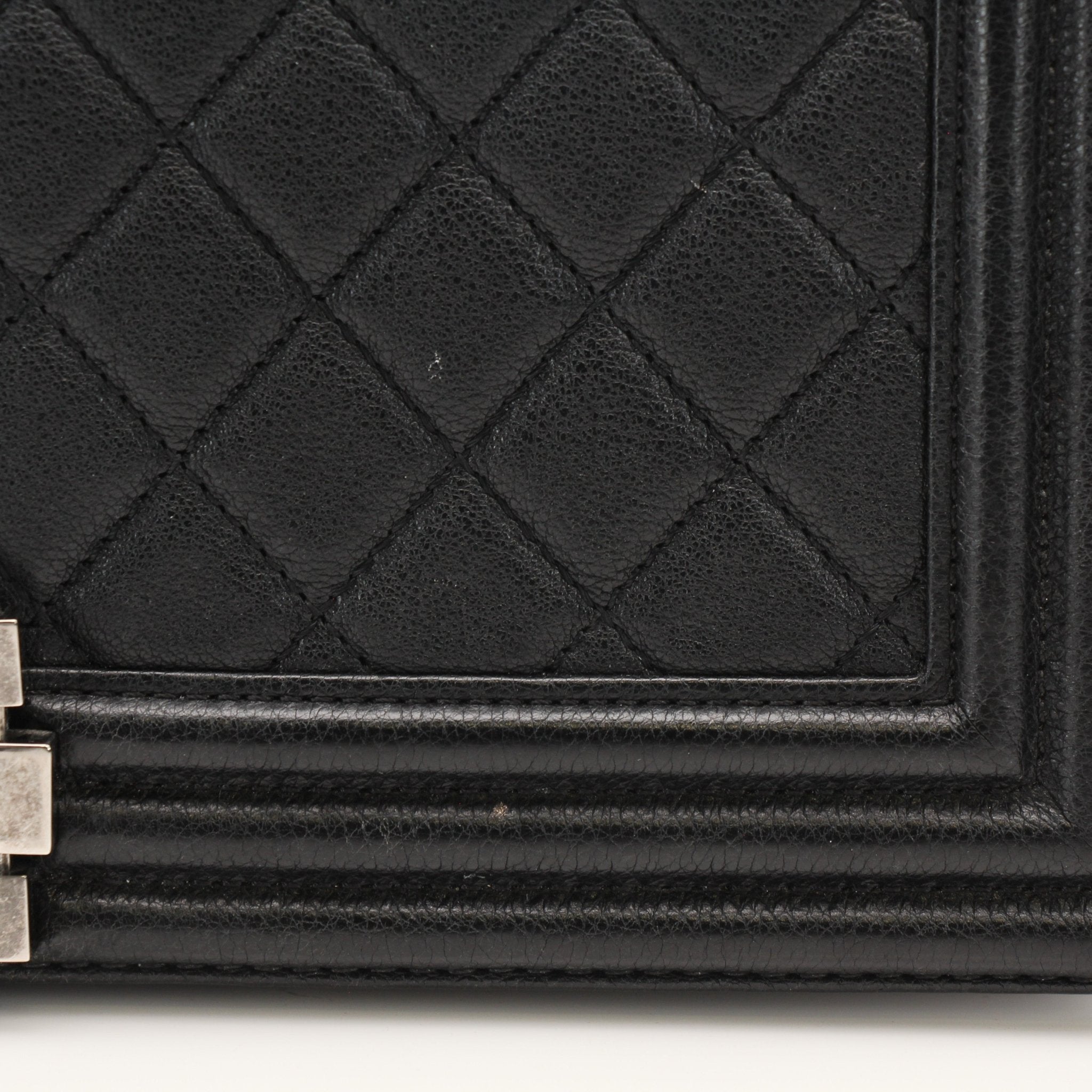 Gold & Beyond Chanel Boy Quilted Flap Bag handbag with gold hardware and quilted design, featuring a chain strap and signature logo.