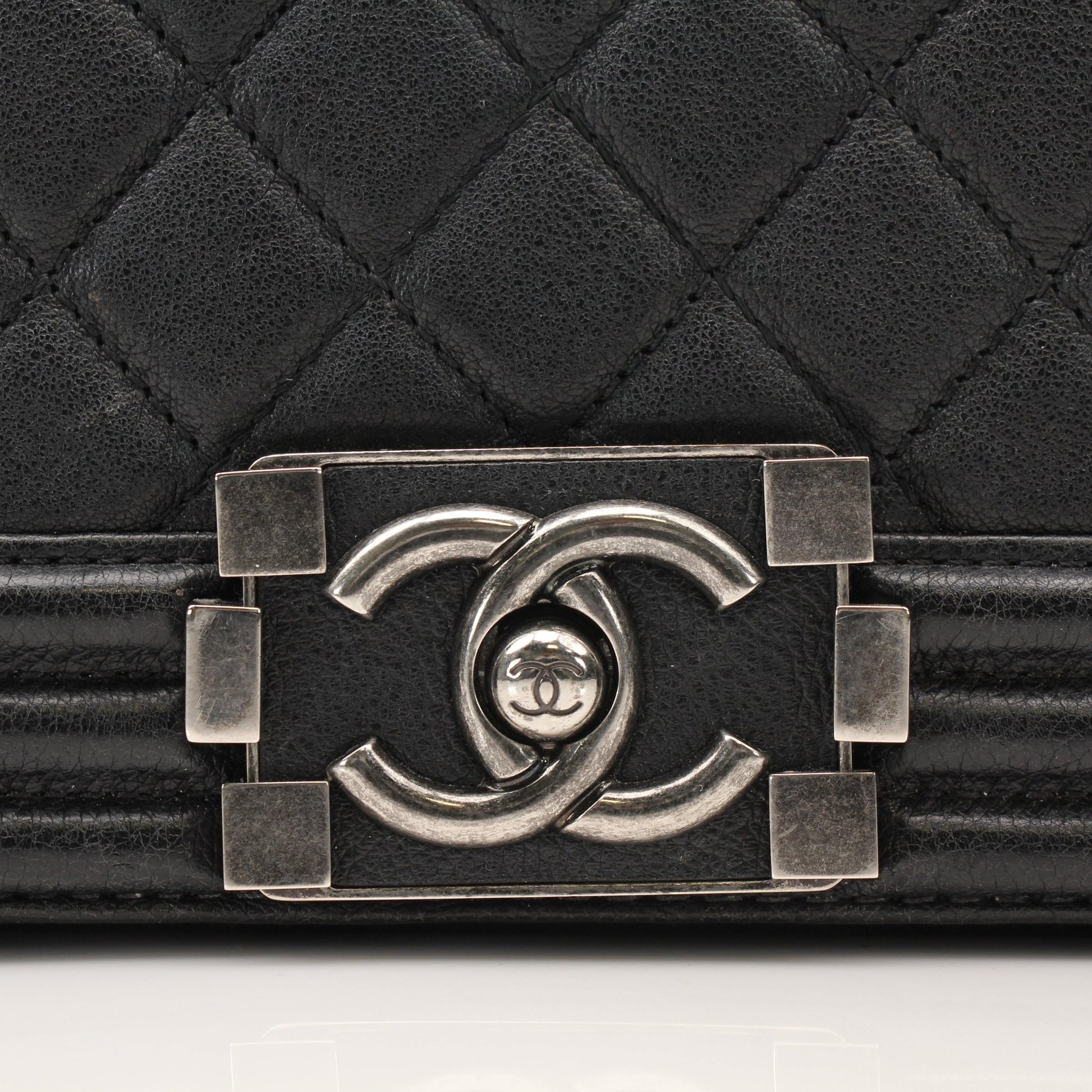 Gold & Beyond Chanel Boy Quilted Flap Bag handbag with gold hardware and quilted leather design.