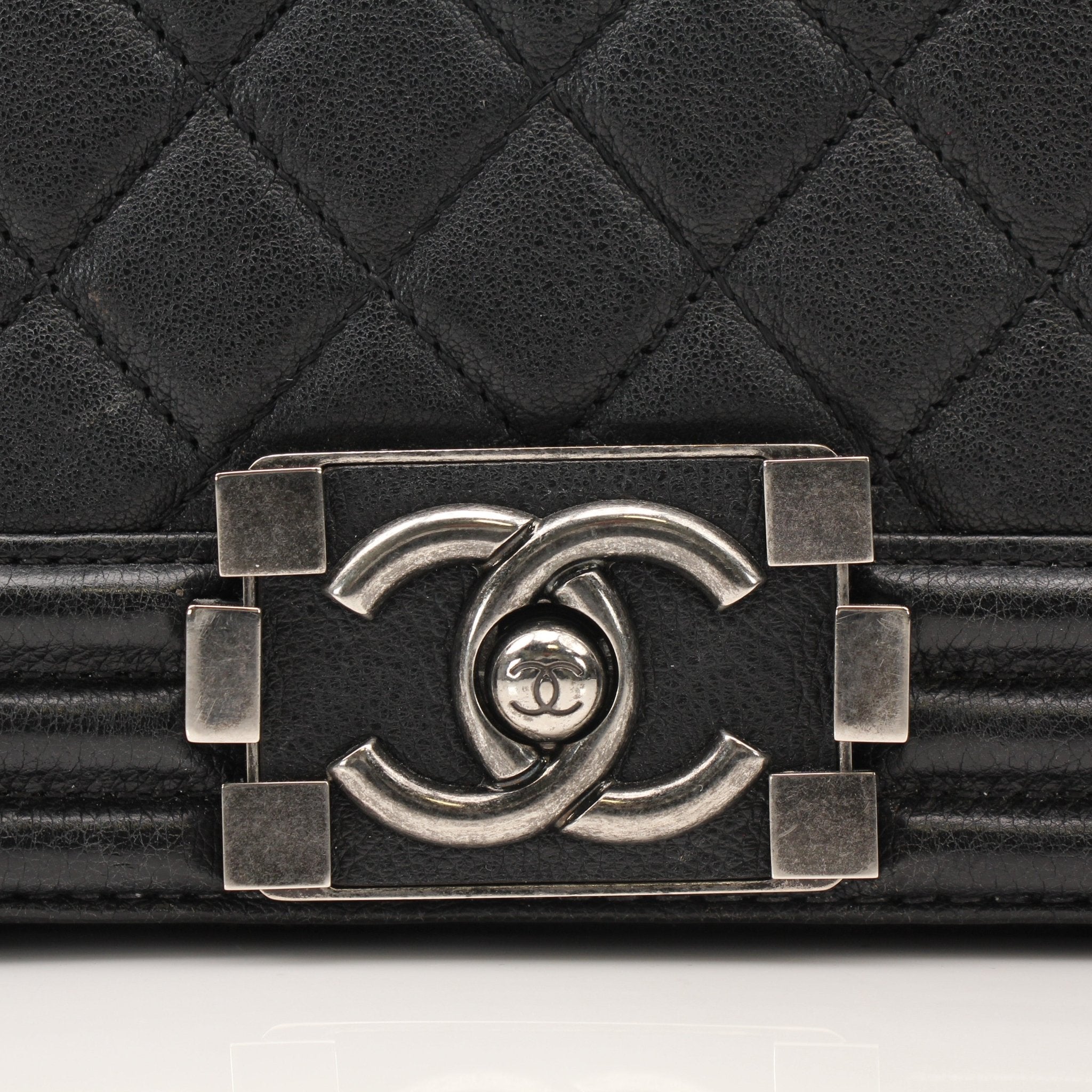 Gold & Beyond Chanel Boy Quilted Flap Bag handbag with gold hardware and quilted leather design.
