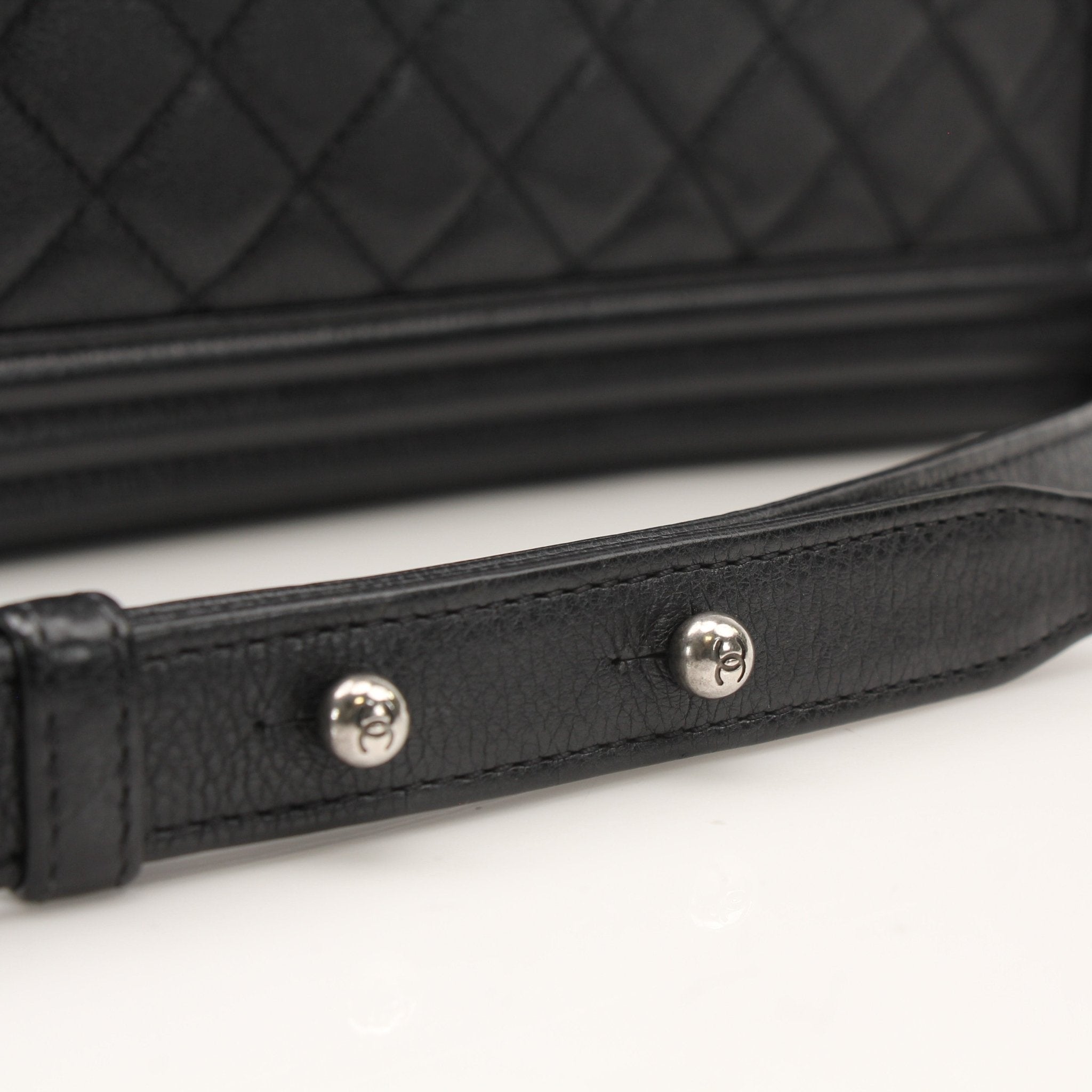 Gold & Beyond Chanel Boy Quilted Flap Bag handbag with gold chain strap and signature quilted leather design.