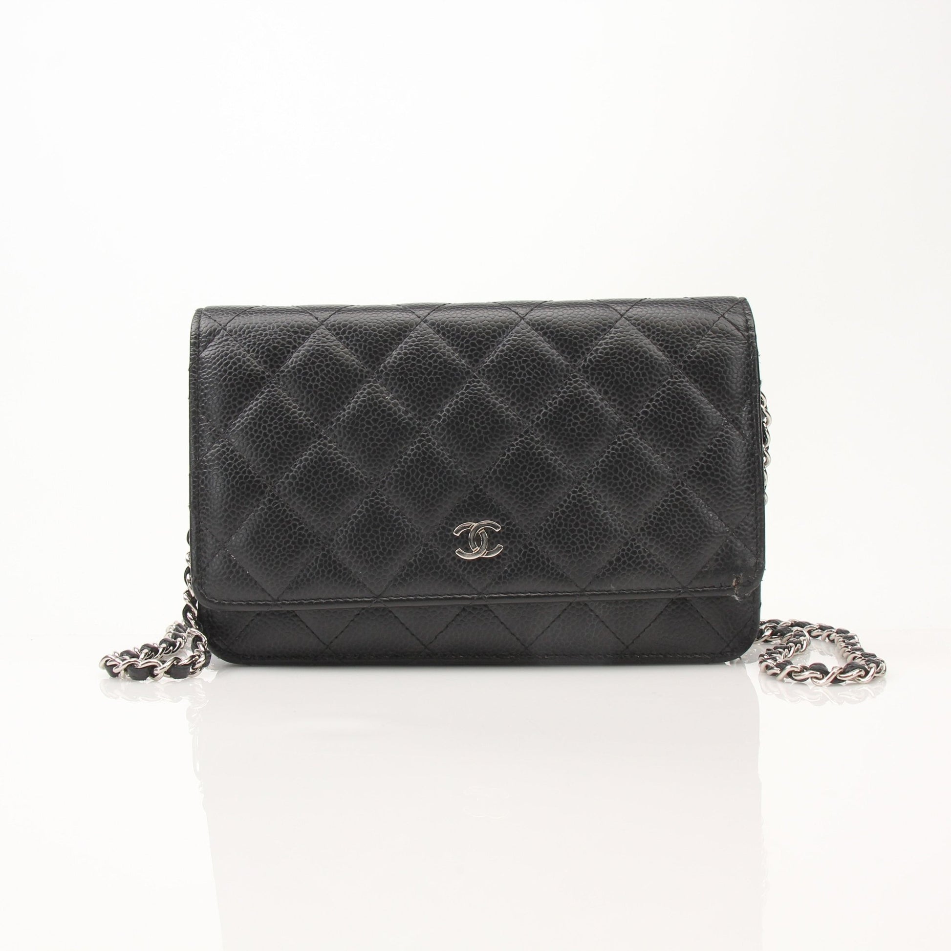 Black Chanel Wallet on Chain with gold hardware, featuring compact design and classic quilted leather.
