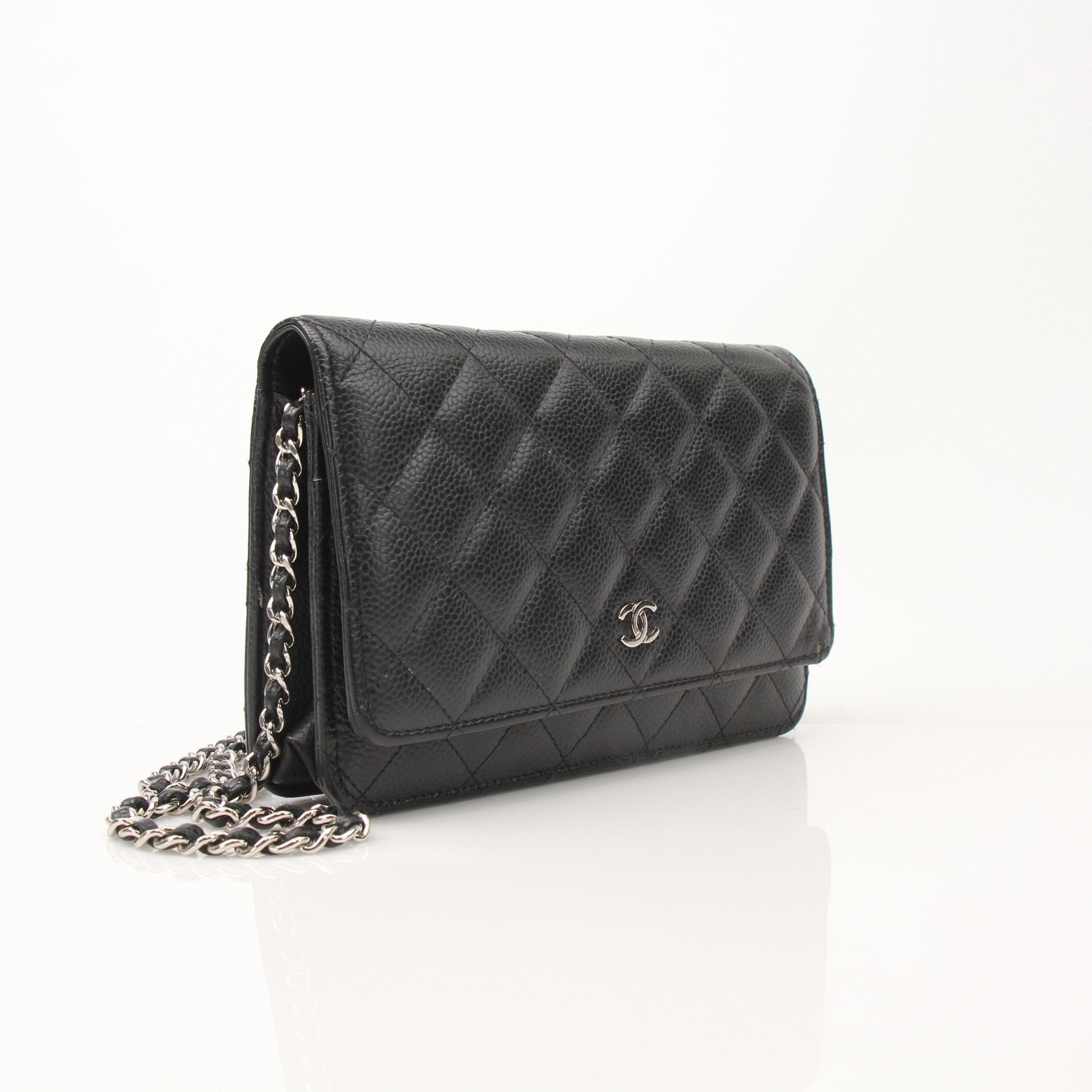 Chanel black wallet on chain with gold hardware, featuring a sleek design and quilted leather for stylish everyday use.