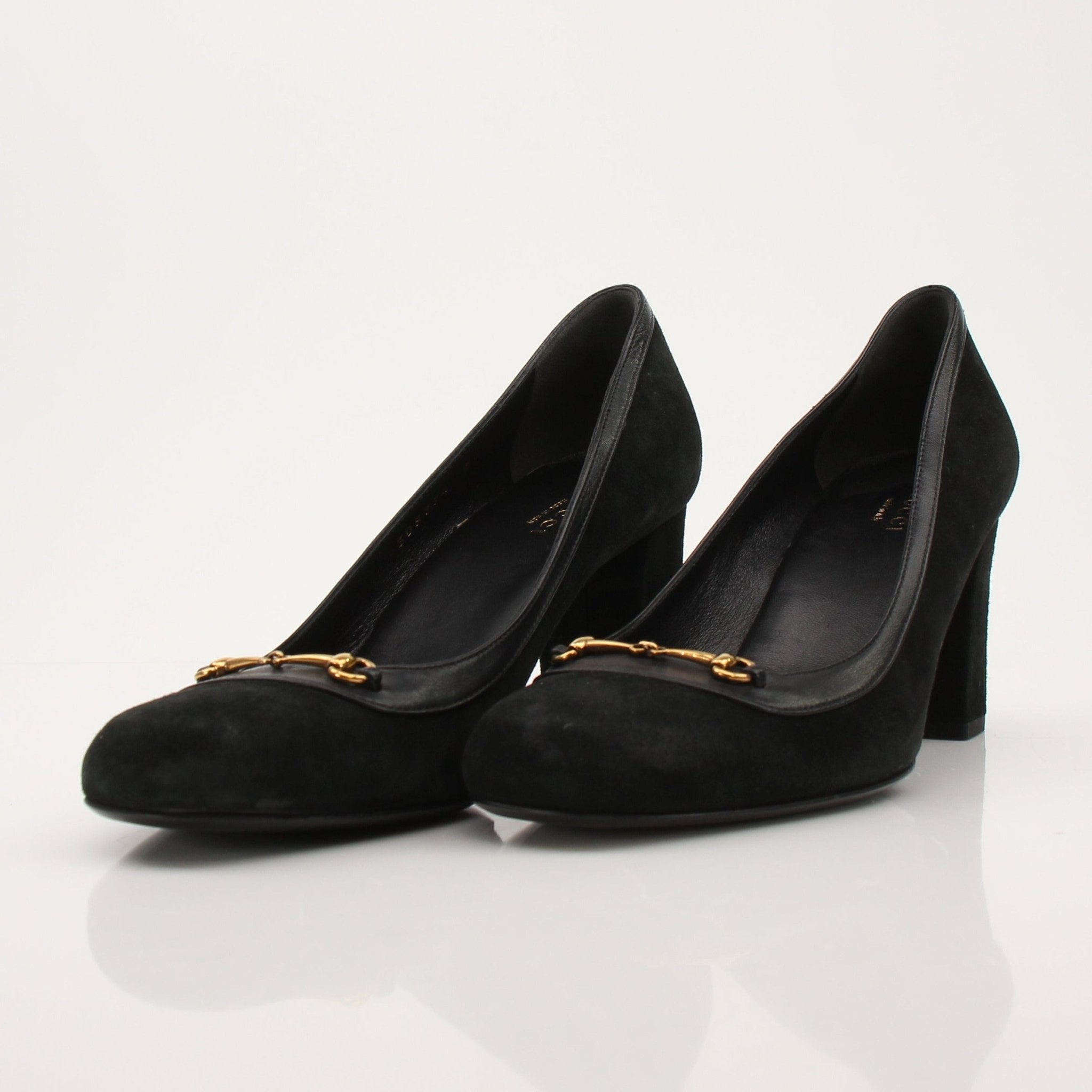 Gold & Beyond Gucci Horsebit leather loafers shoes featuring classic design and sleek craftsmanship.