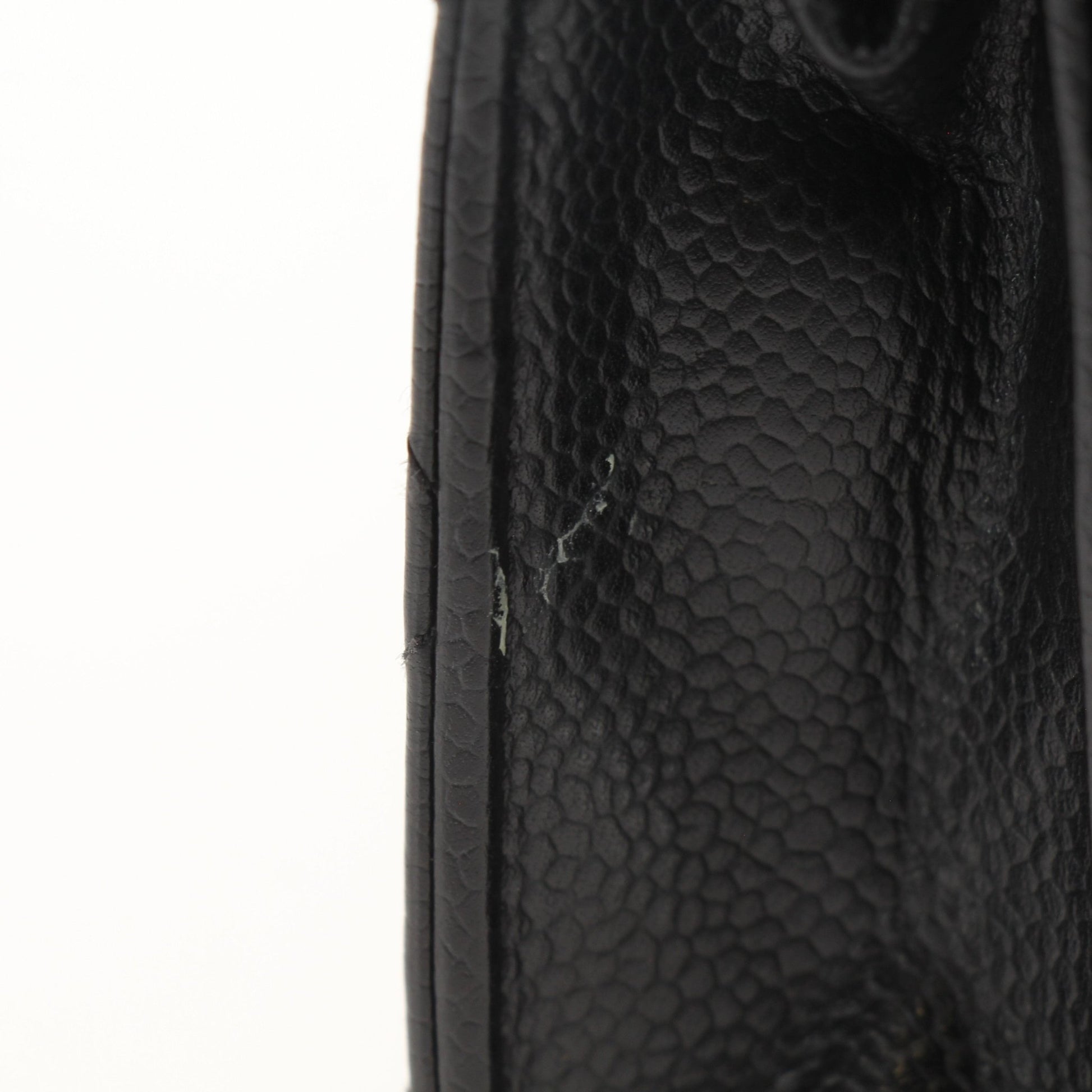 Chanel black wallet on chain with gold accents, featuring a sleek design and compact size, crafted by Gold & Beyond.