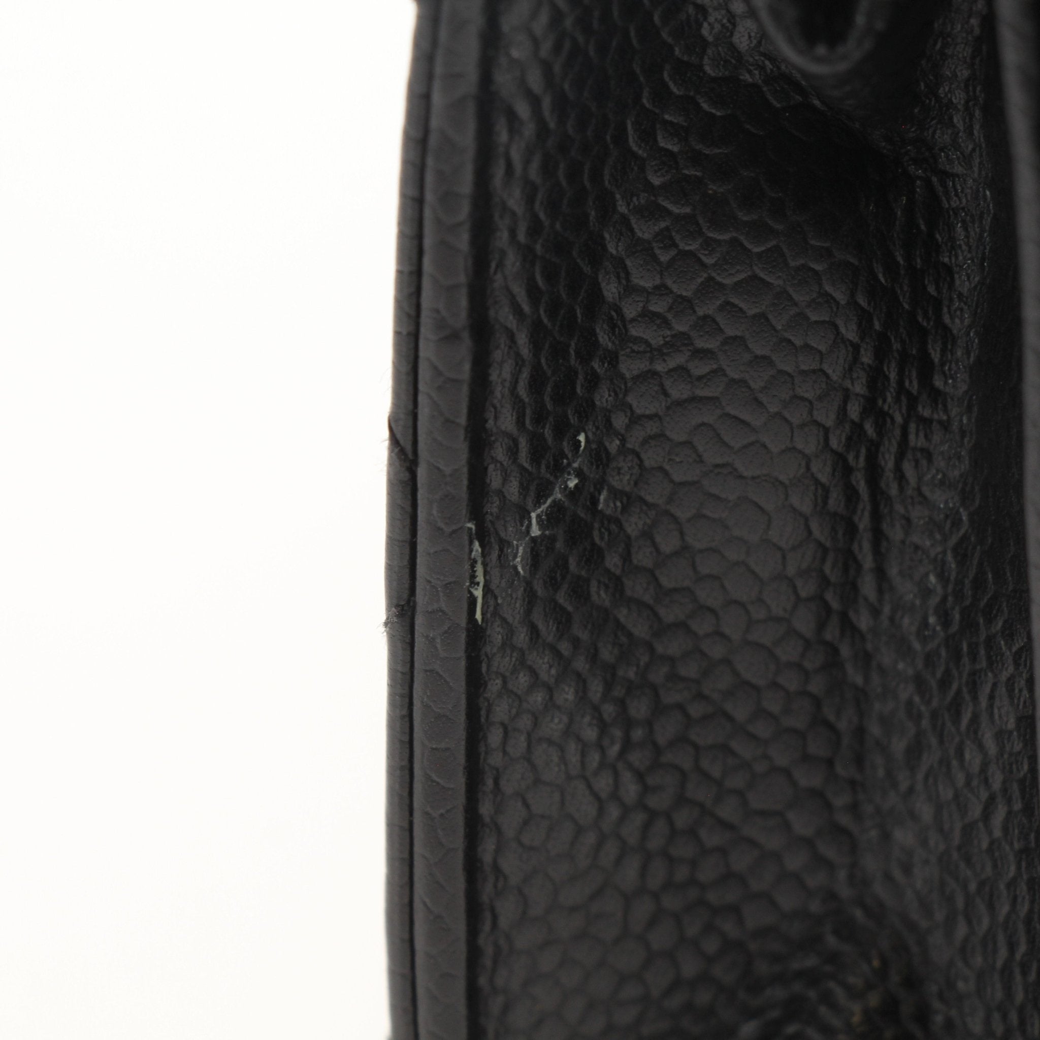 Chanel black wallet on chain with gold accents, featuring a sleek design and compact size, crafted by Gold & Beyond.