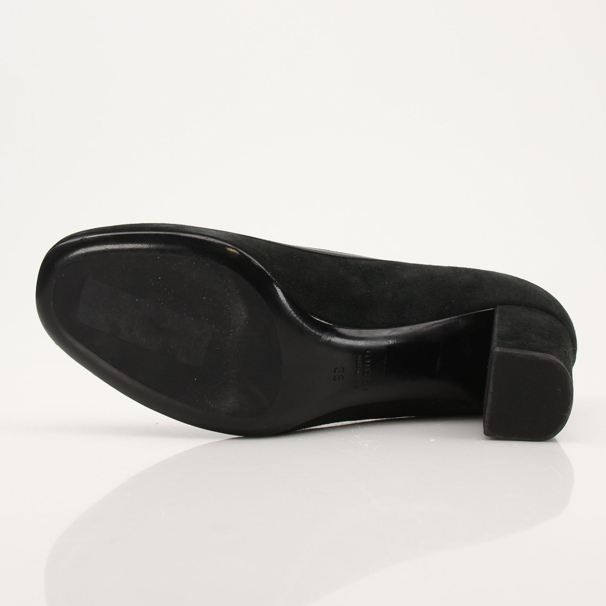 Gold & Beyond Gucci Horsebit leather loafers, stylish men's shoes with classic horsebit detail and sleek black leather finish.