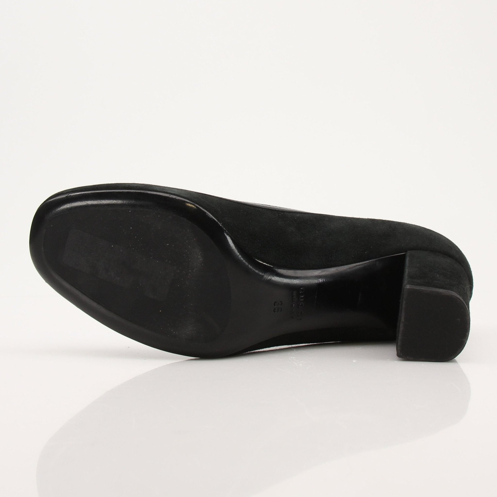 Gold & Beyond Gucci Horsebit leather loafers, stylish men's shoes with classic horsebit detail and sleek black leather finish.