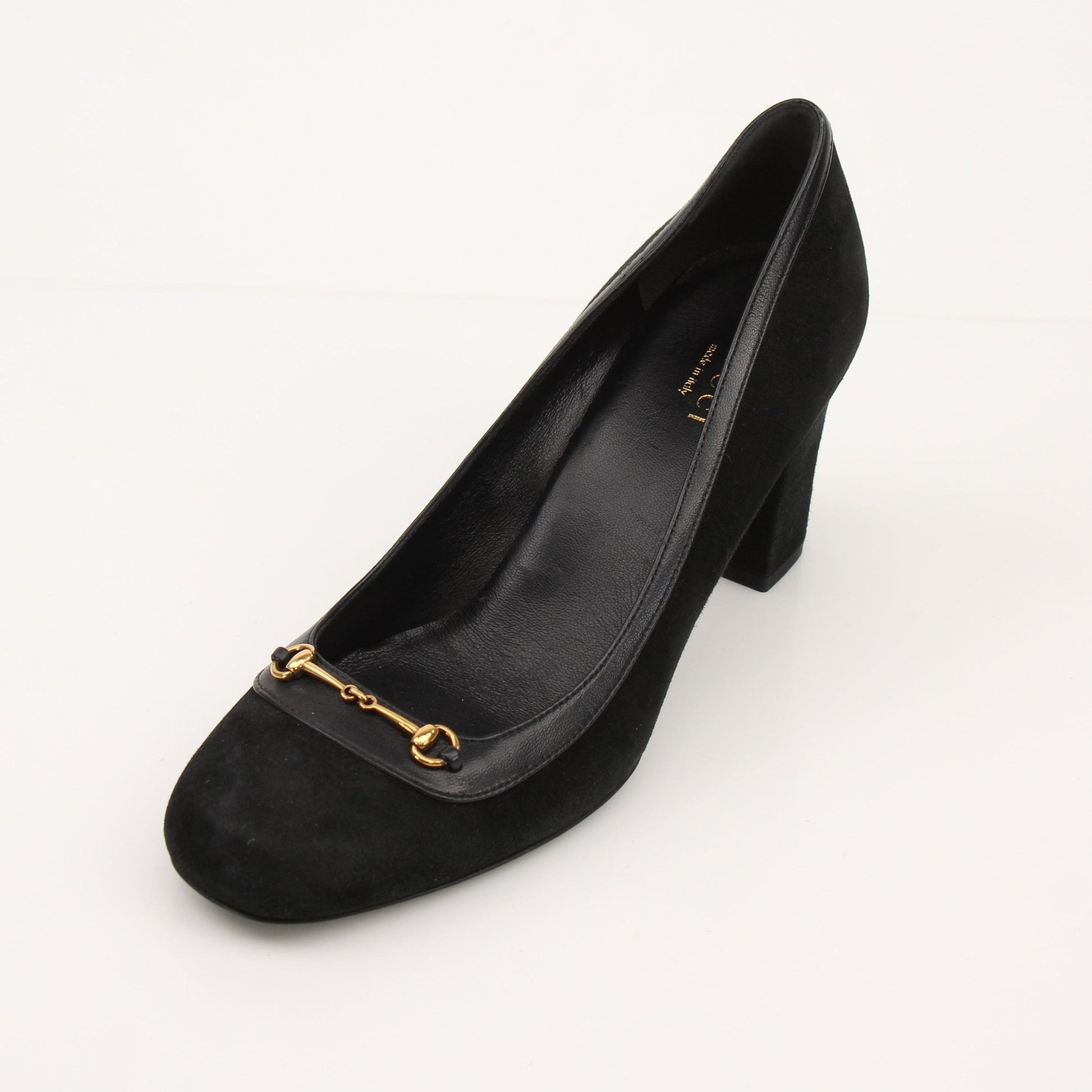 Gold & Beyond Gucci Horsebit leather loafers, stylish men's shoes with classic design and horsebit detail, on a neutral background.