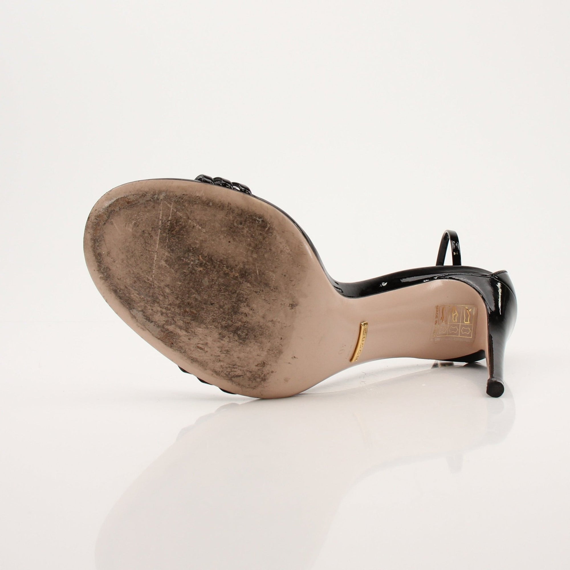 Gold & Beyond Gucci Isle ankle strap heels featuring stylish design and elegant detailing, perfect for fashionable occasions.