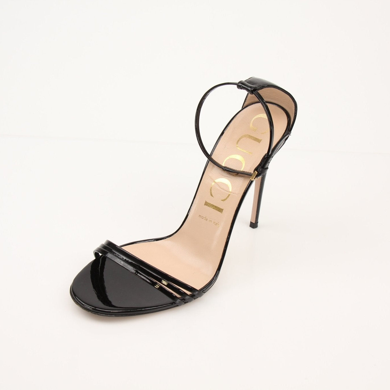 Gold & Beyond Gucci Isle ankle strap heels, stylish open-toe women’s footwear with elegant heel and strap details.