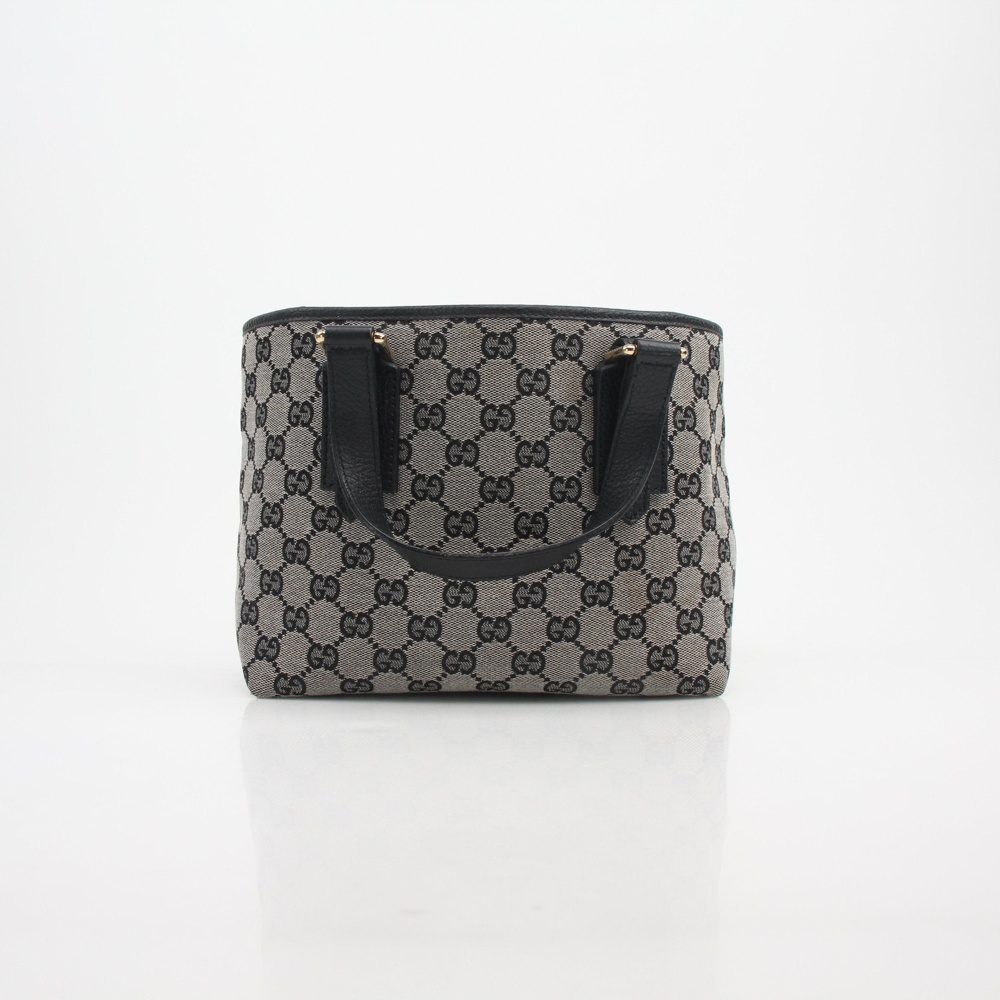 Gold & Beyond Gucci GG Canvas Mini Tote Bag handbag with beige and brown monogram print and leather handles.