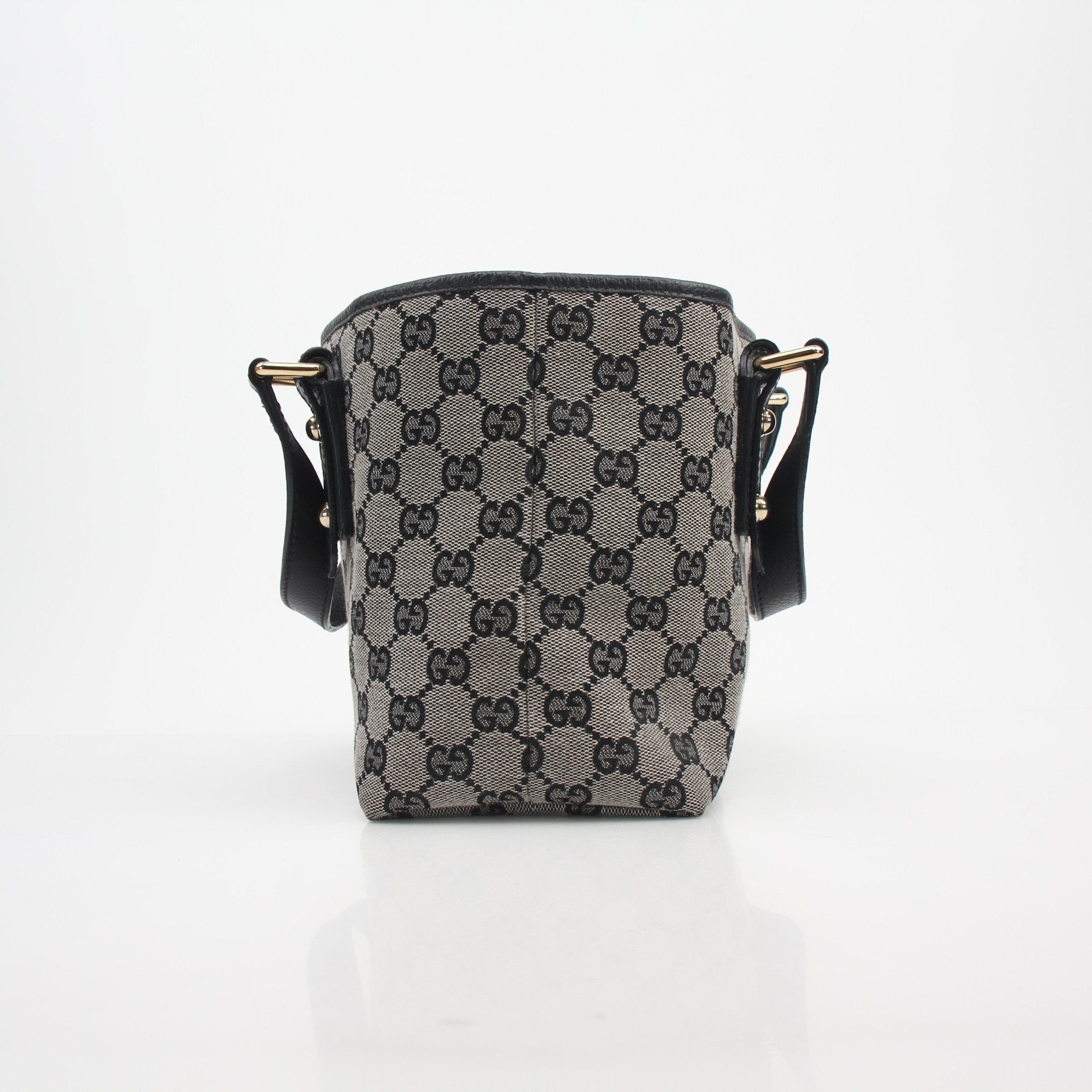 Gold & Beyond Gucci GG Canvas Mini Tote Bag handbag with leather handles and gold-tone hardware, stylish and compact accessory.