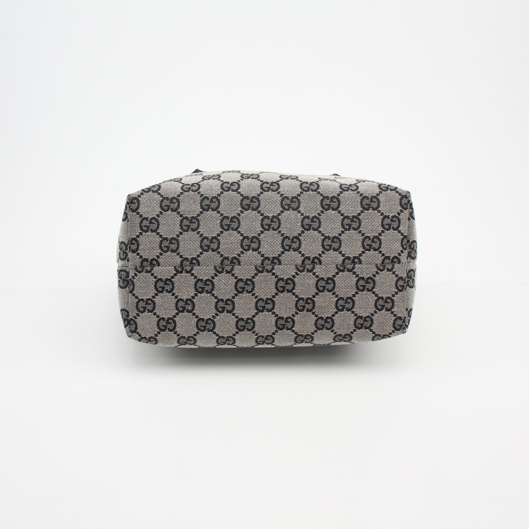 Gucci GG Canvas Mini Tote Bag handbag with gold accents, featuring the signature monogram design and short handles.