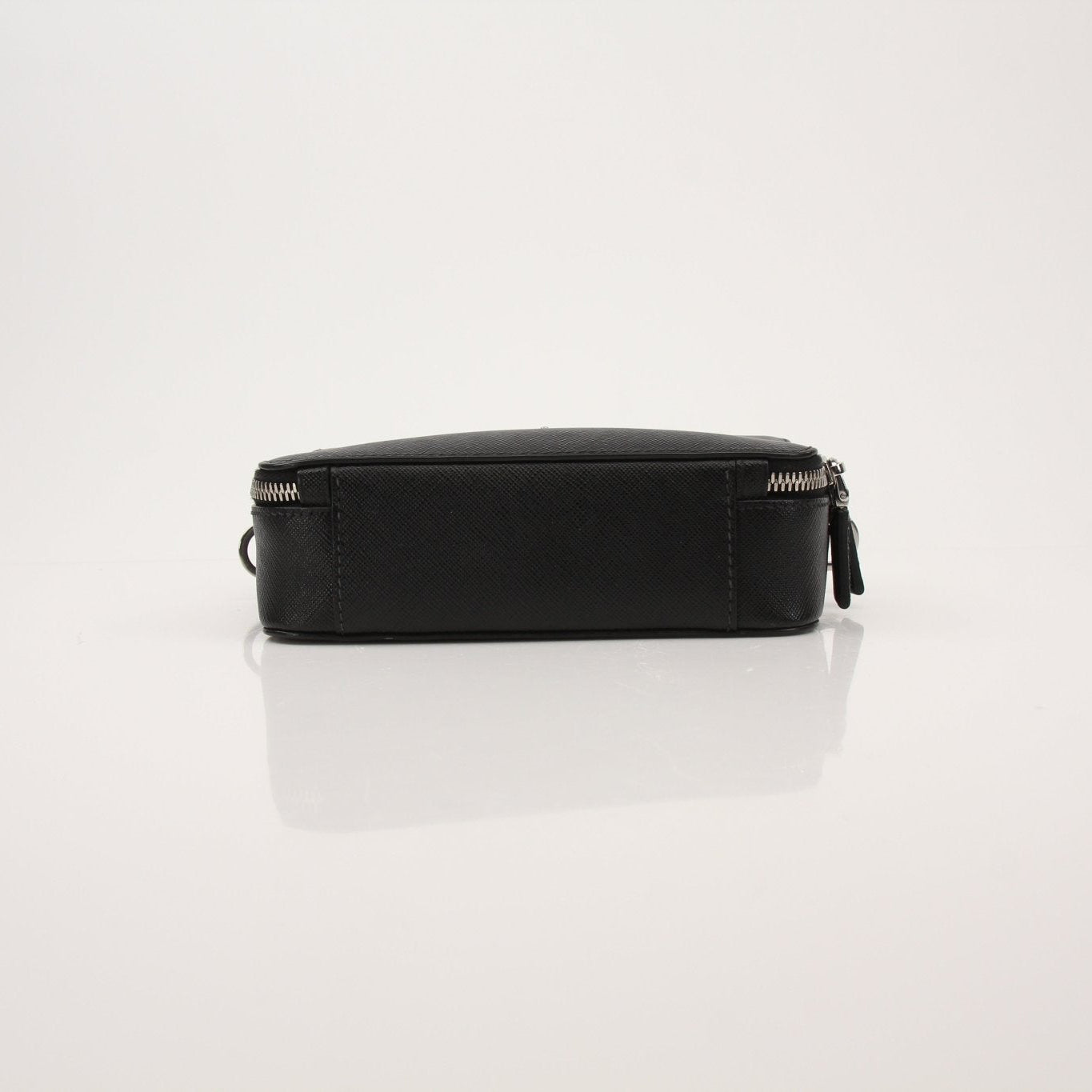 Gold & Beyond Prada Brique handbag with structured design and top handles, featuring a sleek leather finish and gold-tone hardware.