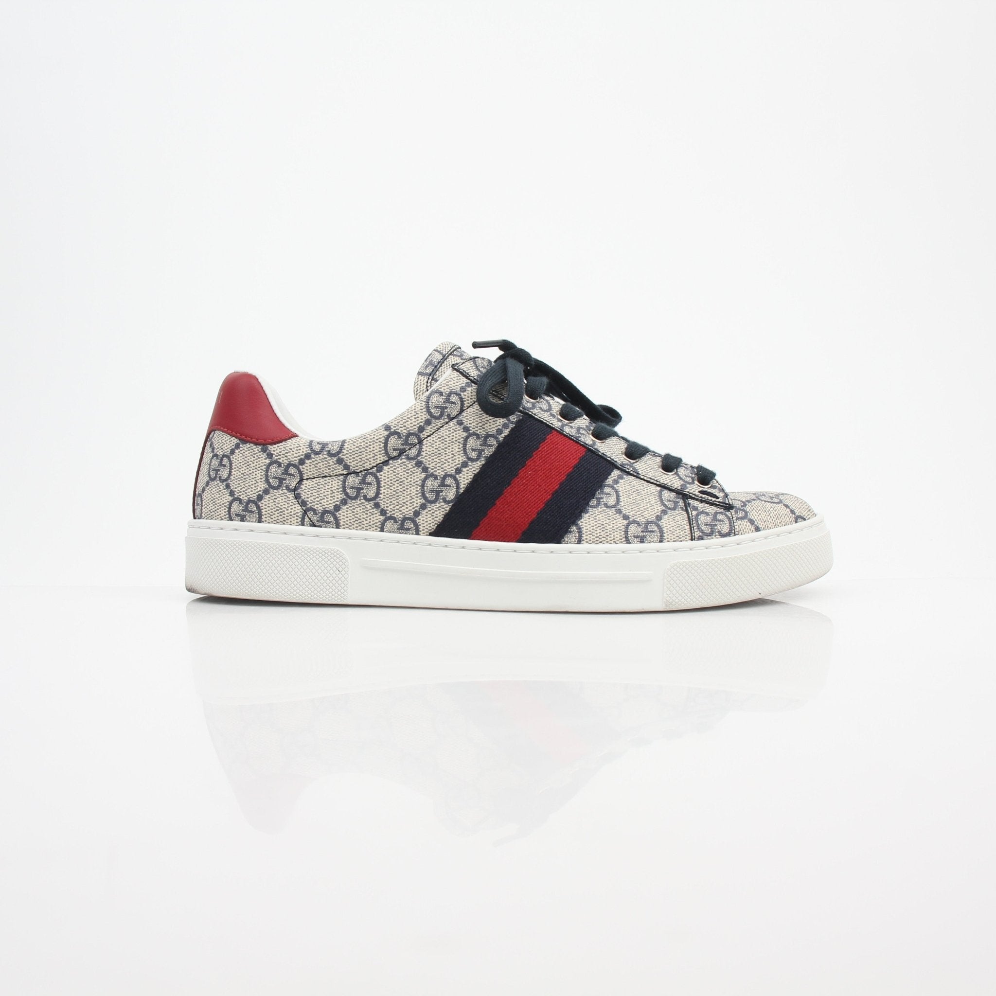 Gucci Women’s Ace GG Supreme Monogram Web sneakers with white rubber soles and signature monogram pattern.