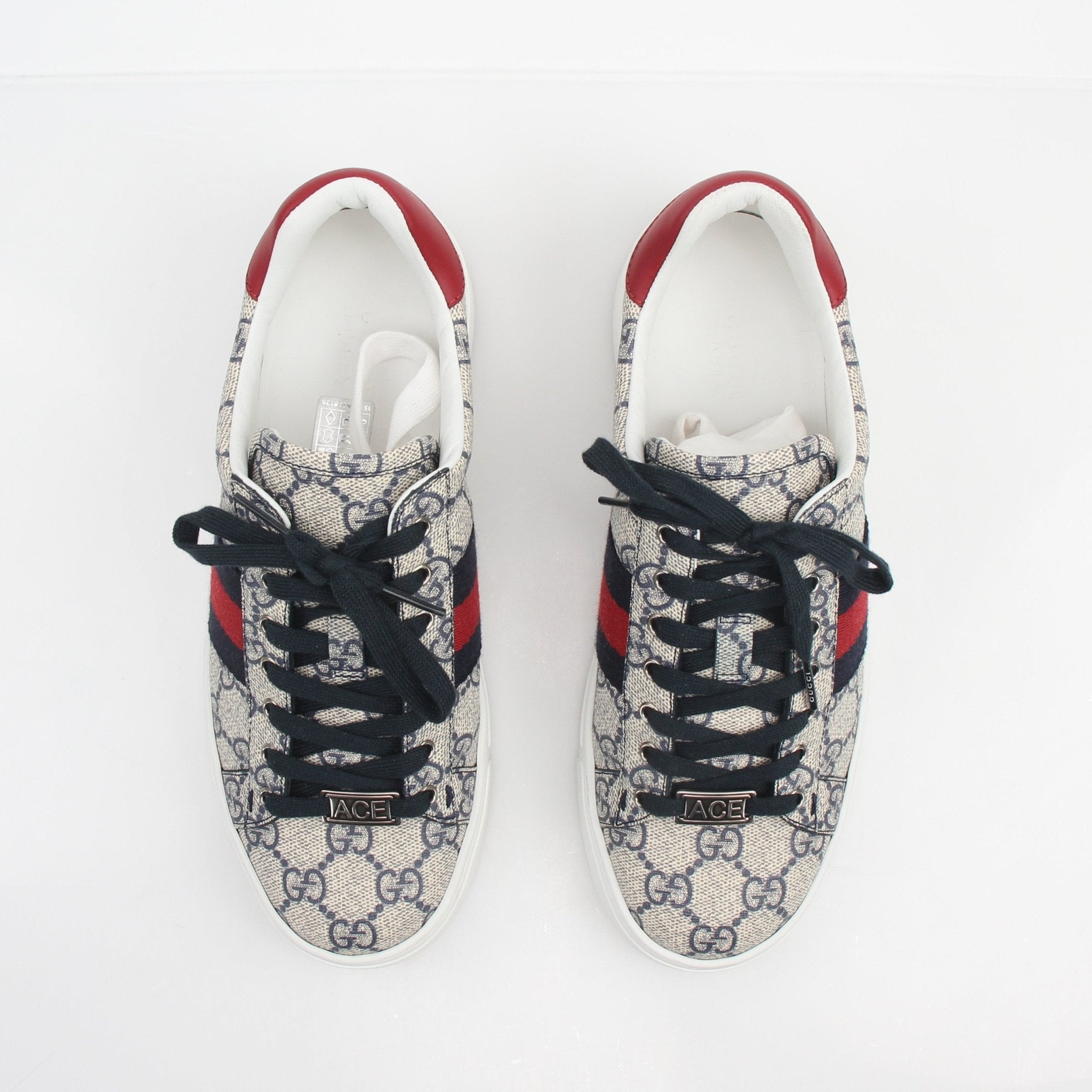 Gucci Women’s Ace GG Supreme Monogram Web sneakers, stylish shoes with signature monogram and web detail, on a white background.