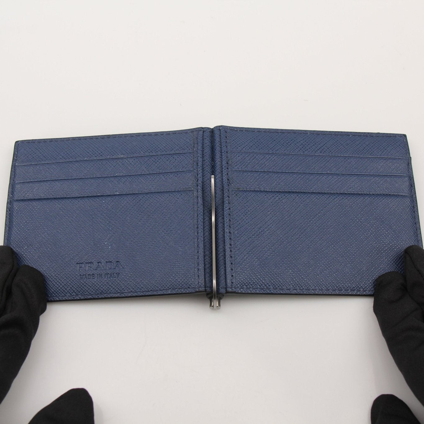 Gold & Beyond Prada Saffiano leather money clip wallet with sleek design and secure clip for cash and cards.