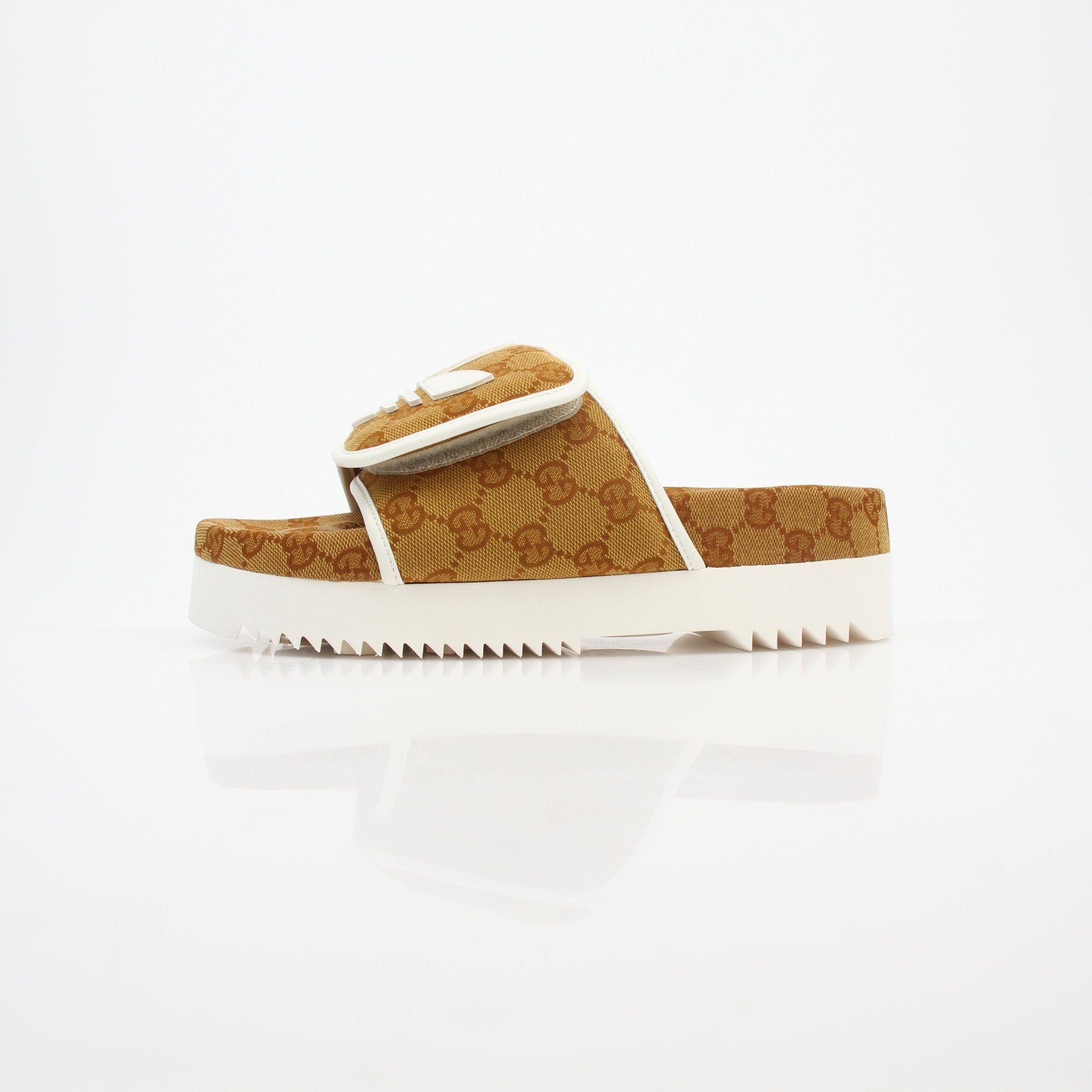 Gold & Beyond Gucci x Adidas GG Canvas Trefoil Platform Slide Sandals showing the stylish logo design and platform sole.
