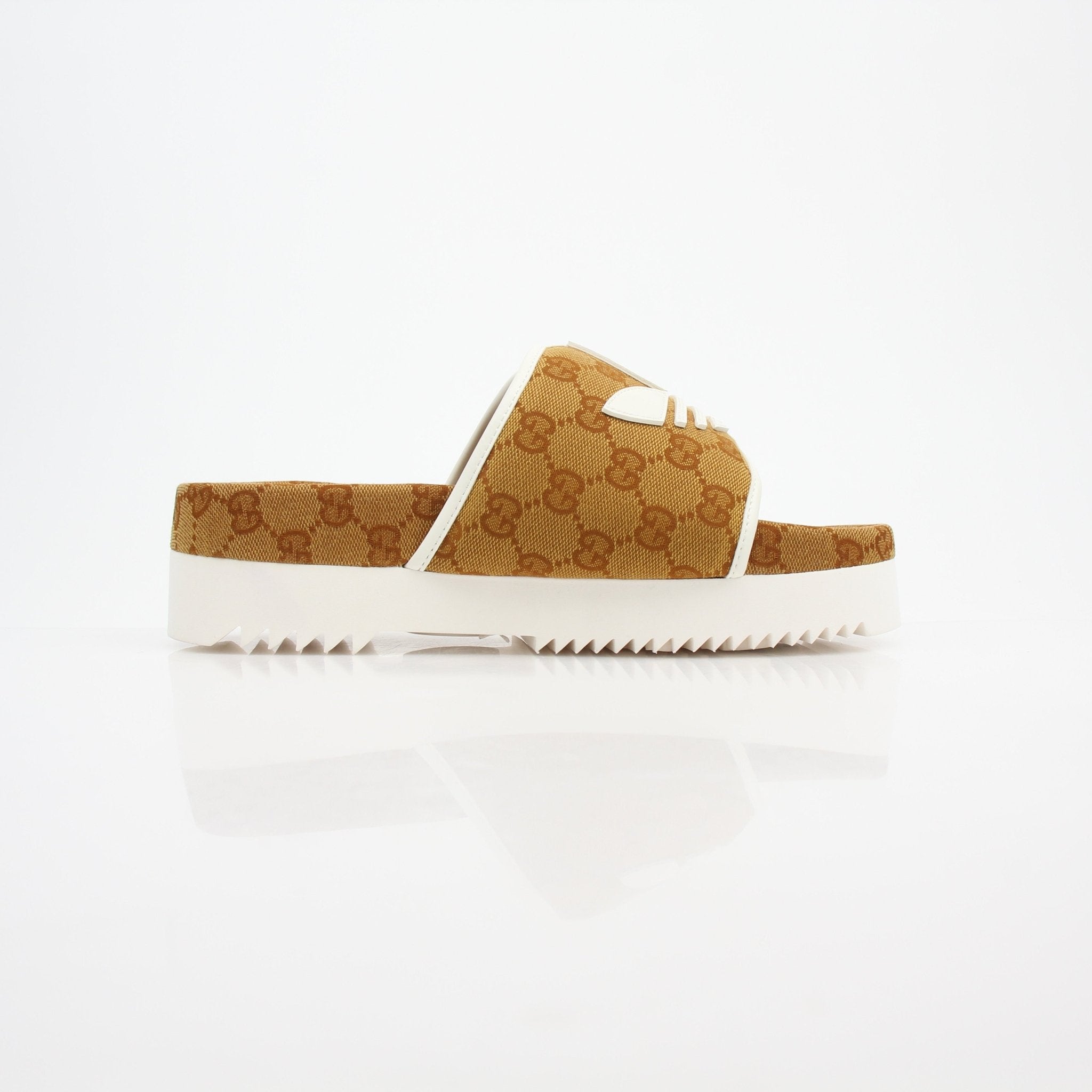 Gold & Beyond Gucci x Adidas GG Canvas Trefoil Platform Slide Sandals, stylish shoes with branded canvas and platform sole.