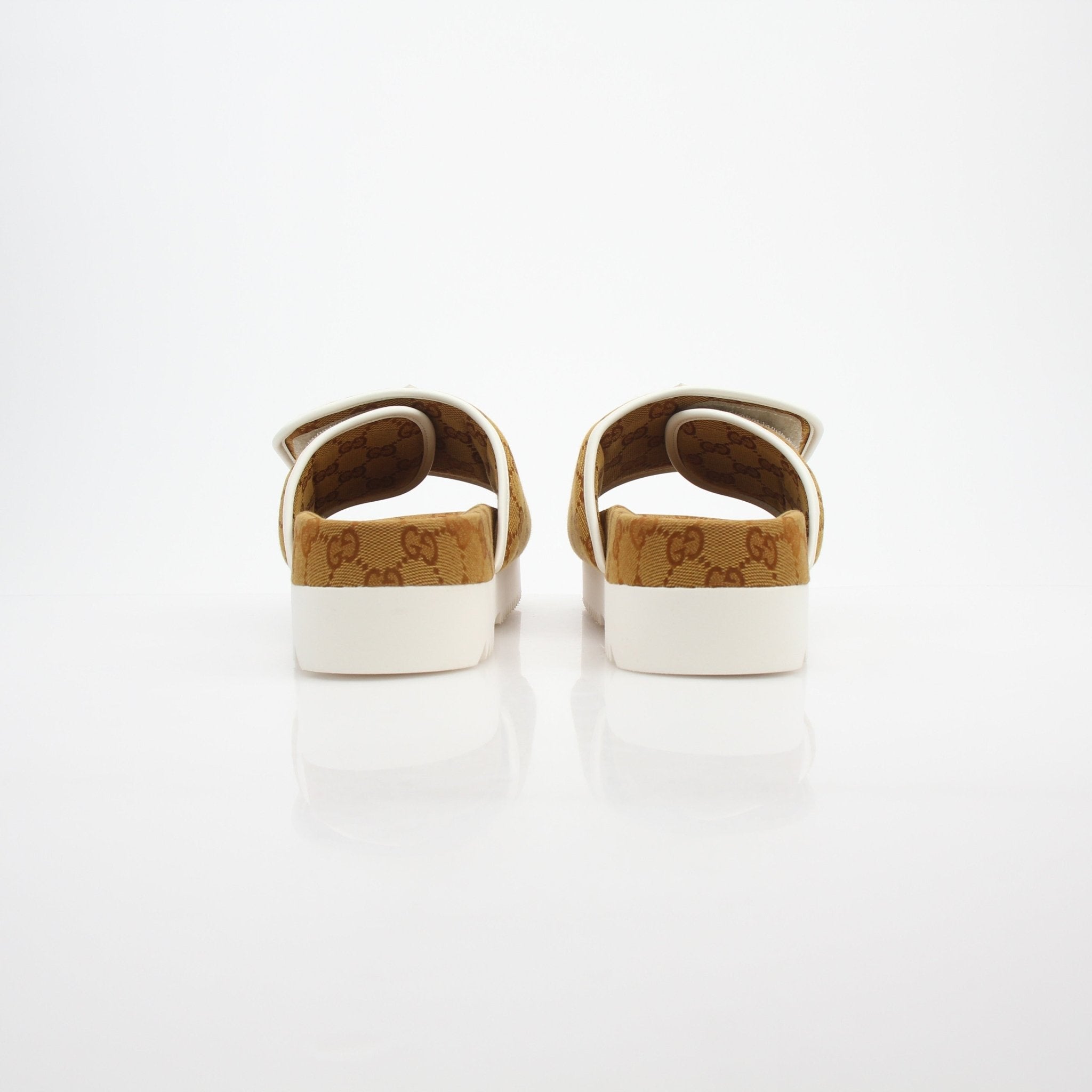 Gold & Beyond Gucci x Adidas GG Canvas Trefoil Platform Slide Sandals with woven straps and logo details, casual footwear for warm weather.
