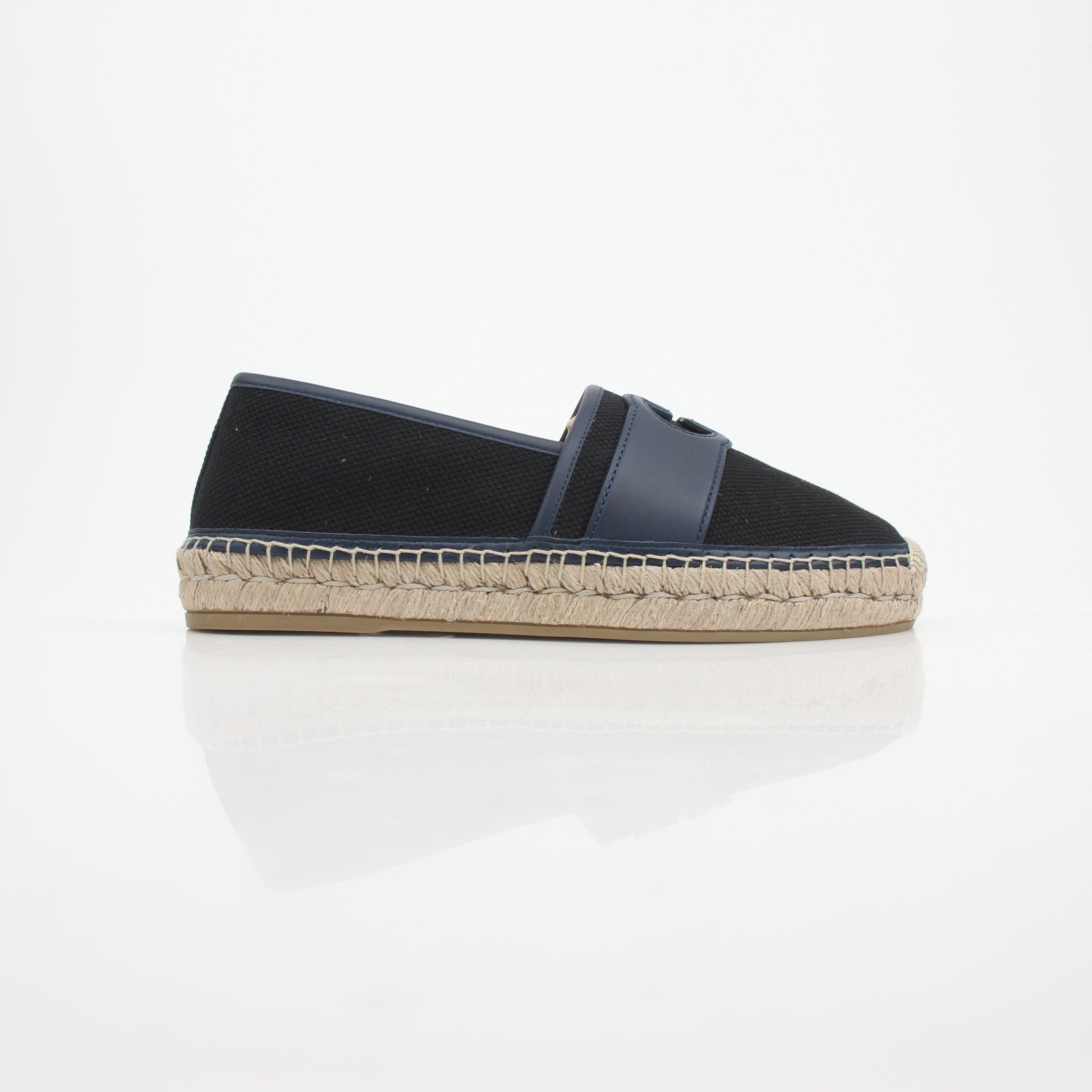 Gucci men's interlocking G canvas espadrille shoes with woven sole and casual slip-on style, displayed on a neutral background.