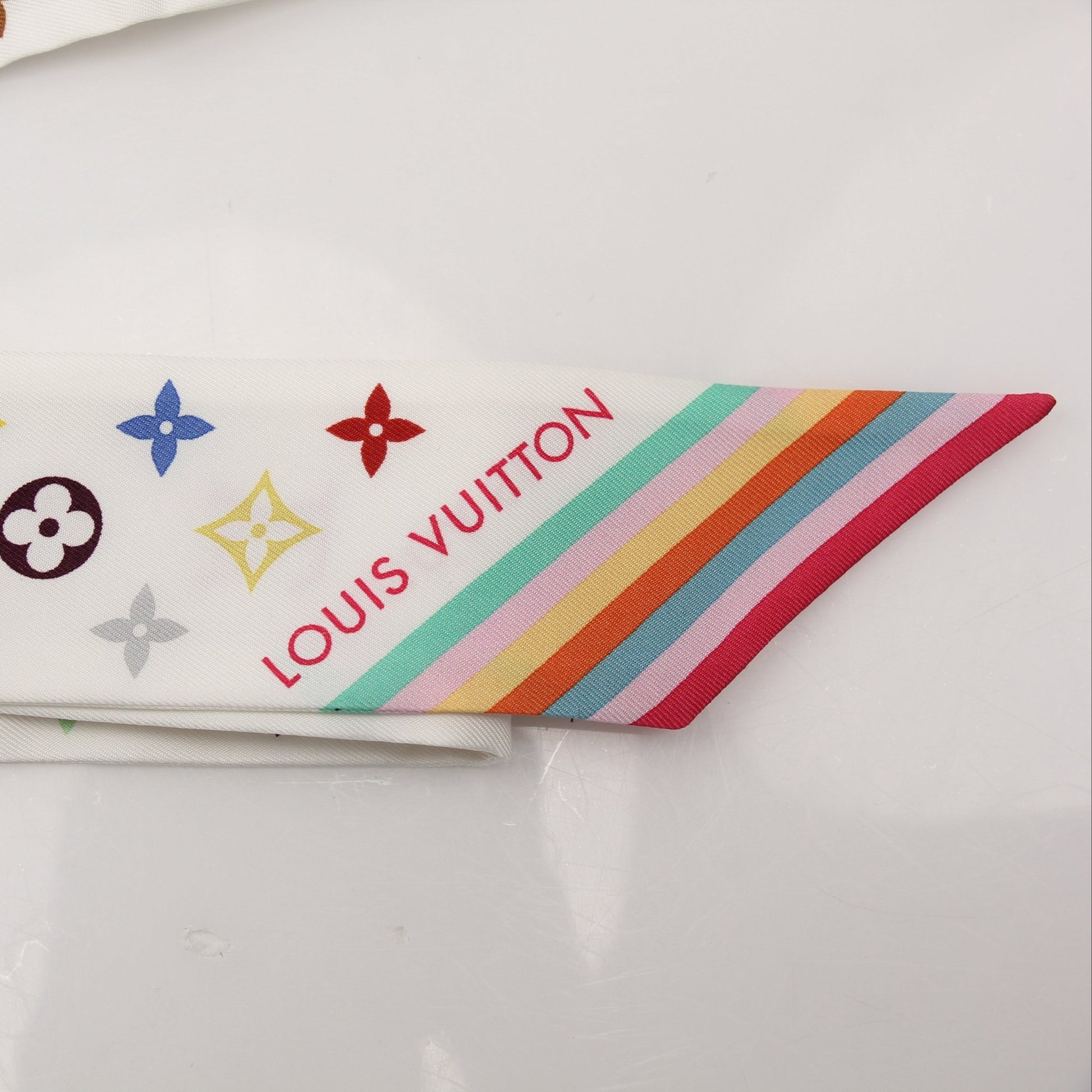 Louis Vuitton x Murakami multicolor bandeau scarf, vibrant accessories with bold floral and character patterns, leather accents