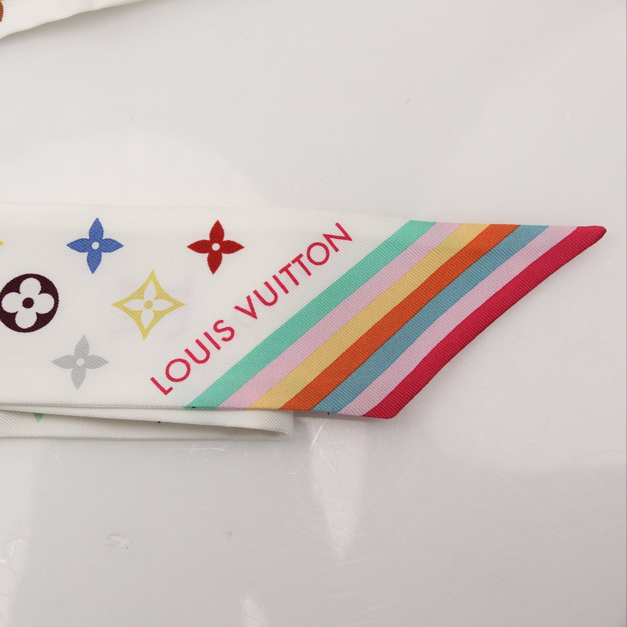 Louis Vuitton x Murakami multicolor bandeau scarf, vibrant accessories with bold floral and character patterns, leather accents