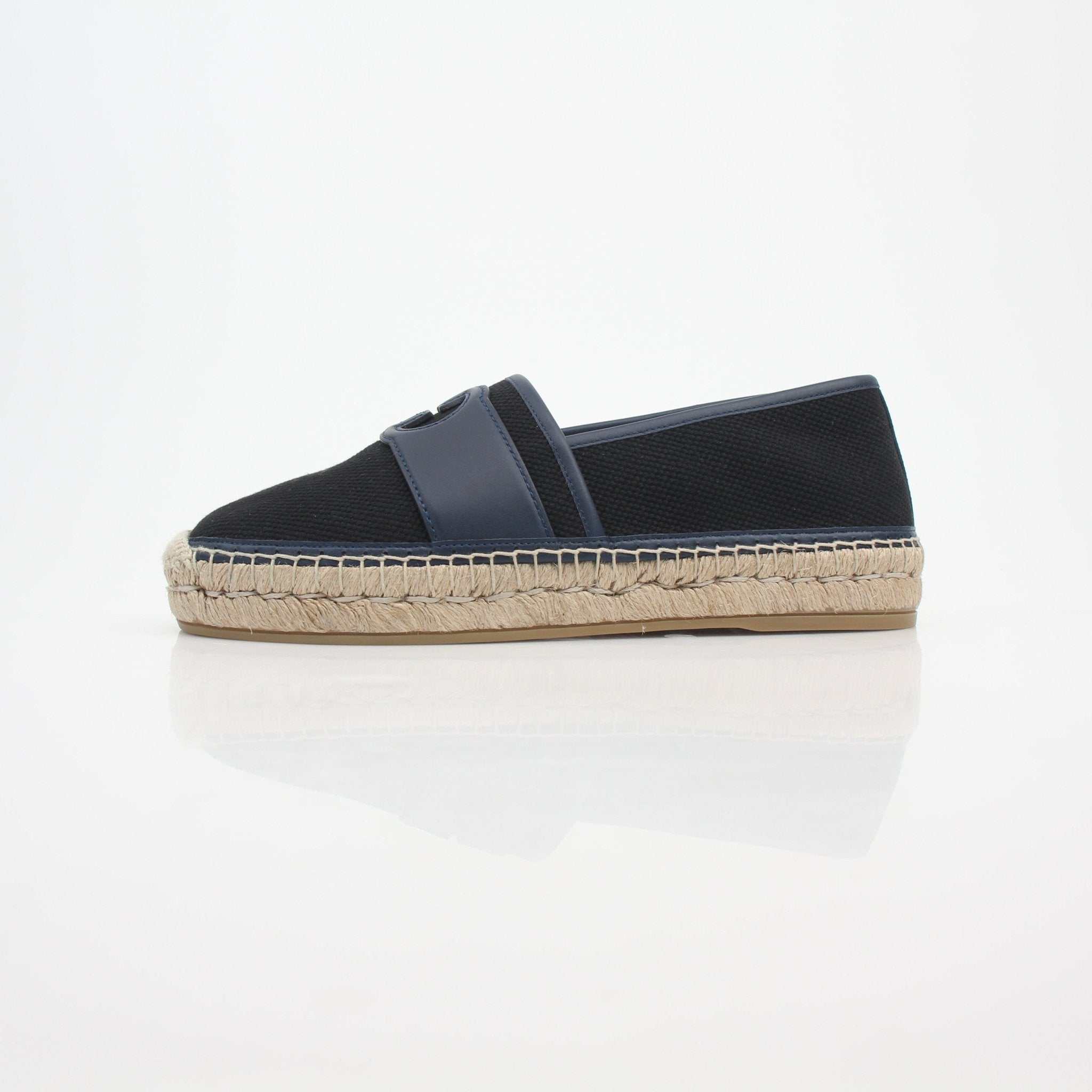 Gucci men's interlocking G canvas espadrille shoes with woven sole and slip-on style, featuring signature branding.