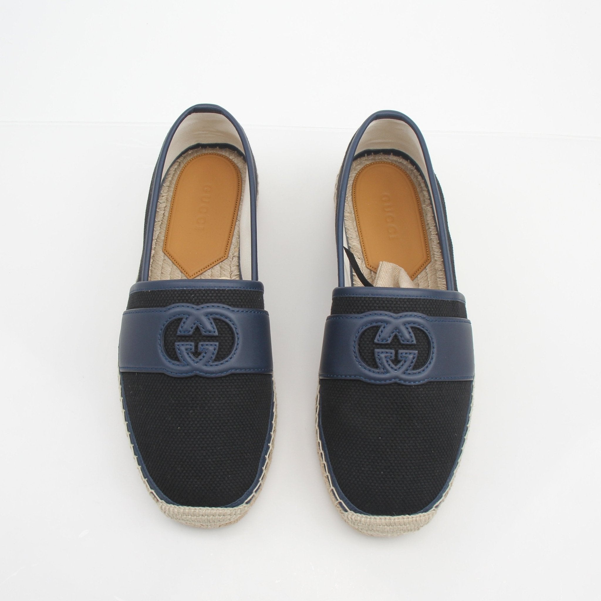 Gucci men's interlocking G canvas espadrille shoes with beige and brown pattern, featuring a jute sole and slip-on design.