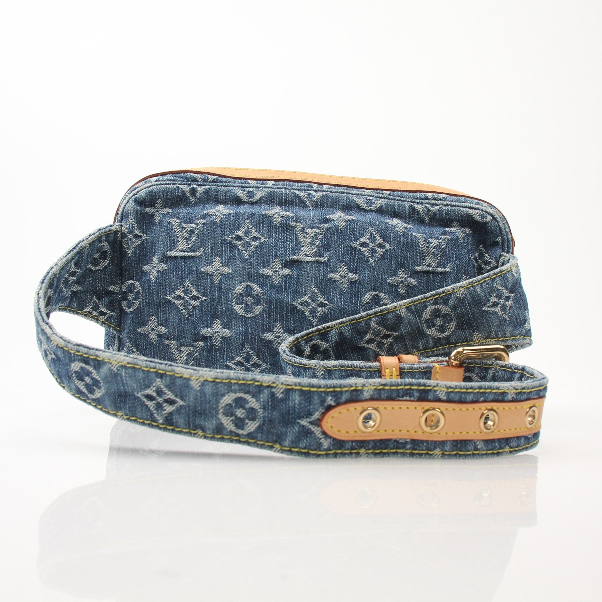 Gold & Beyond Louis Vuitton denim handbag with adjustable strap and front logo, showcasing stylish casual accessory.