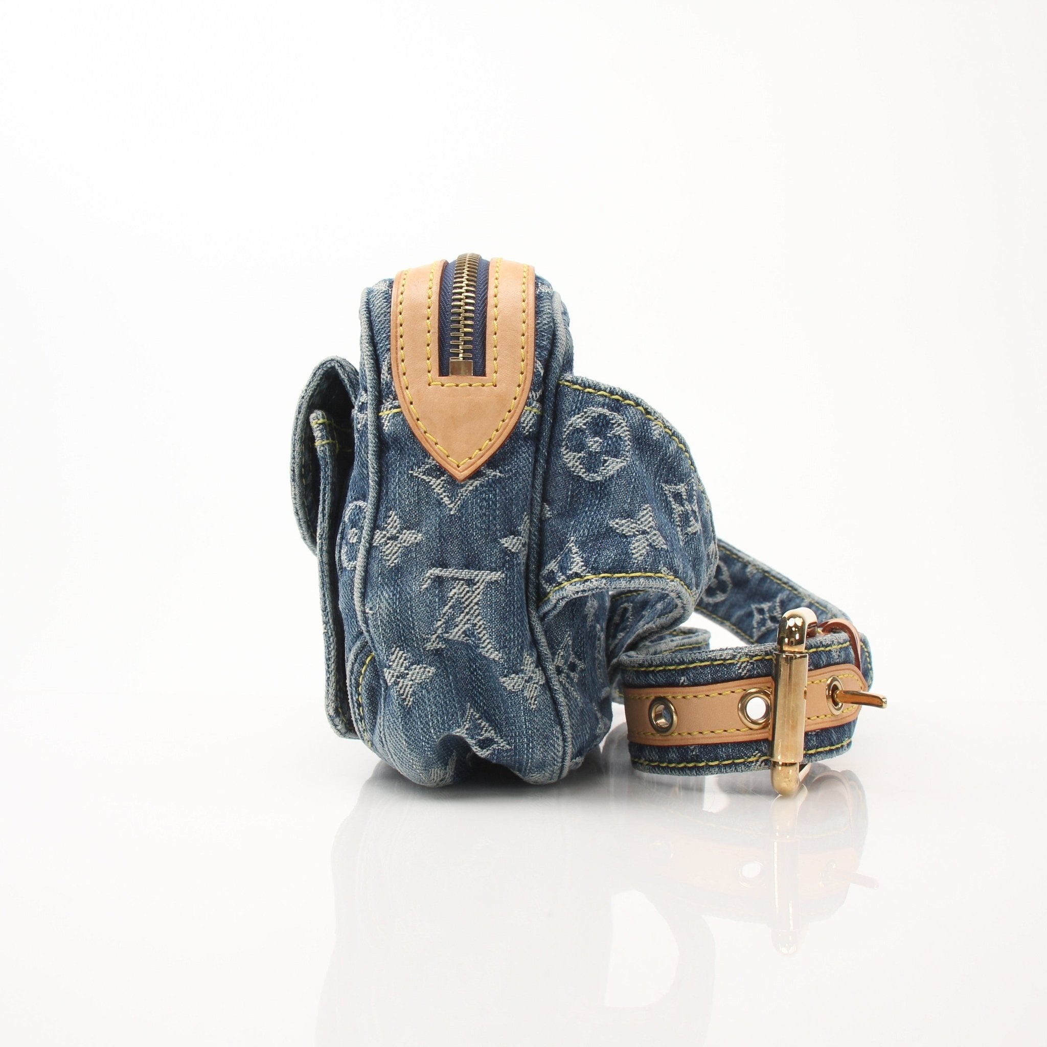 Louis Vuitton denim bum bag handbag with adjustable strap and gold accents, displayed on a neutral background.