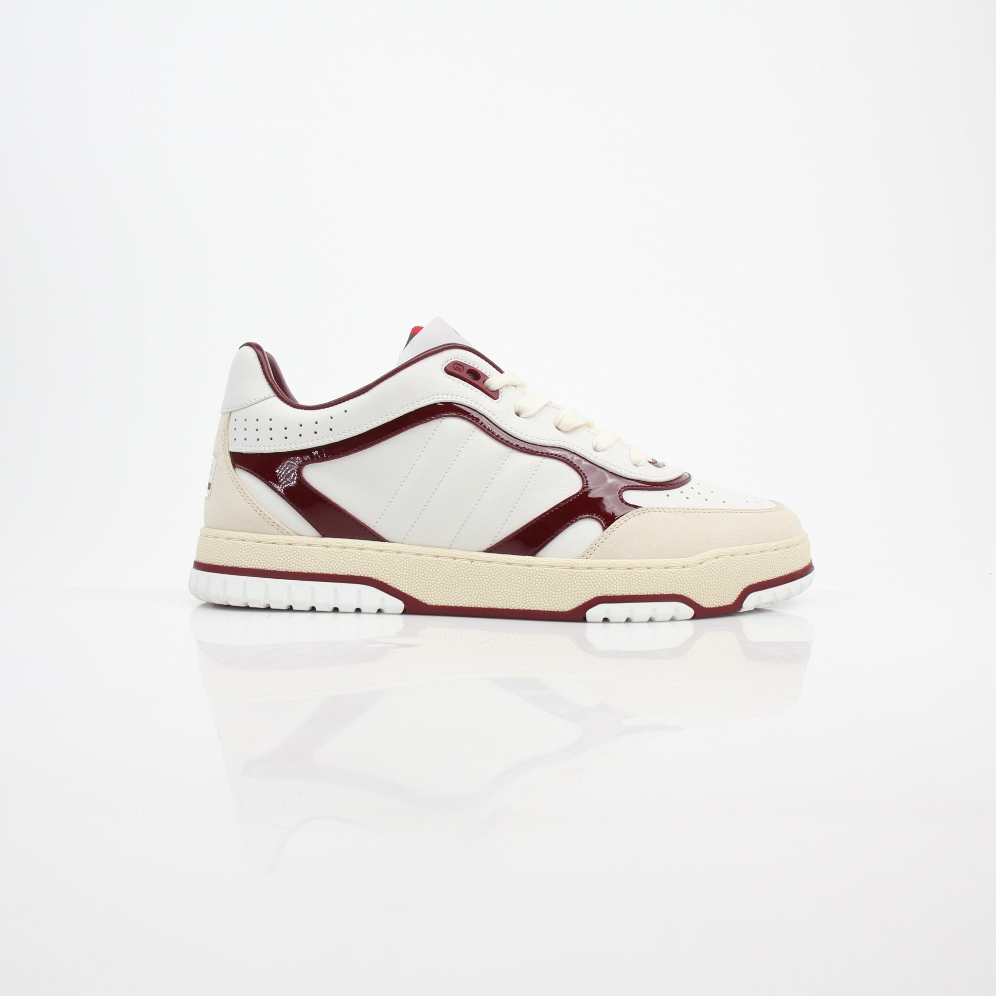 Gucci men's Re-Web low top leather sneakers with white soles and green-red web accents, casual shoe style.