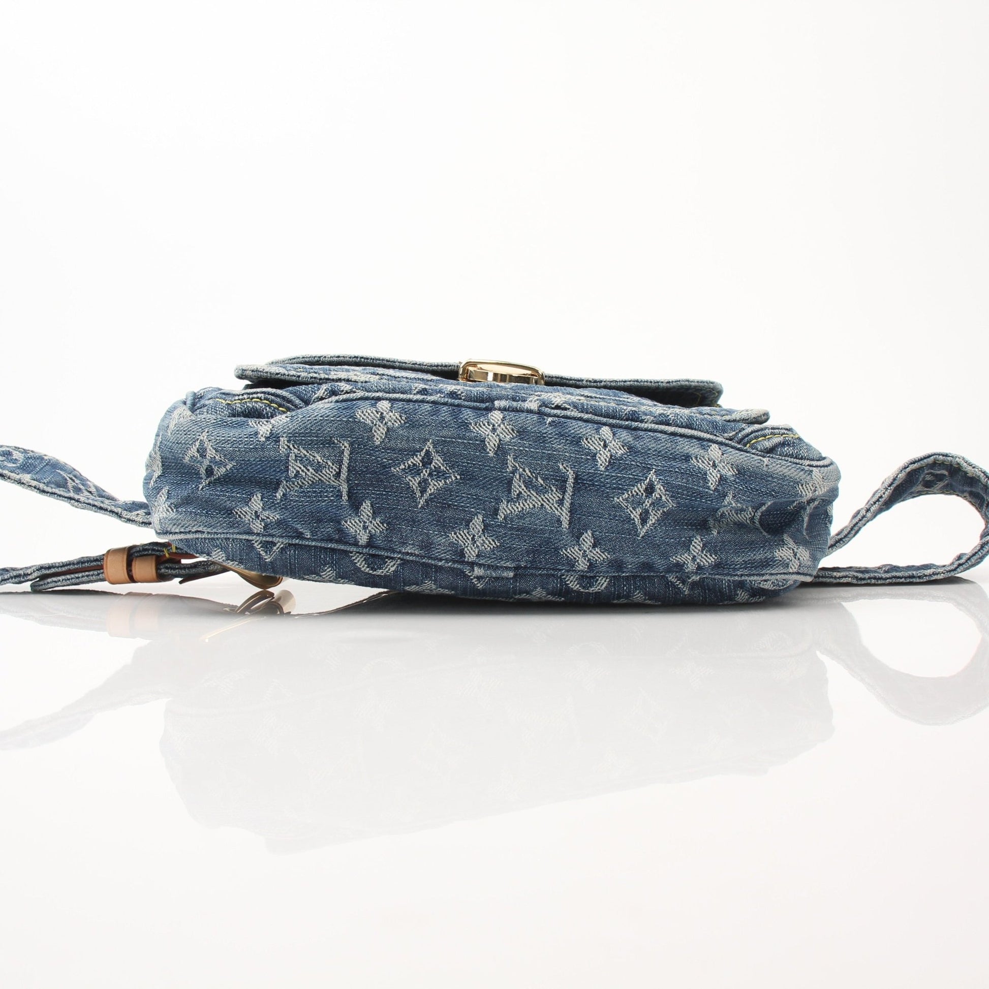 Louis Vuitton denim bum bag handbag with adjustable strap and gold accents, casual accessory for stylish everyday wear.